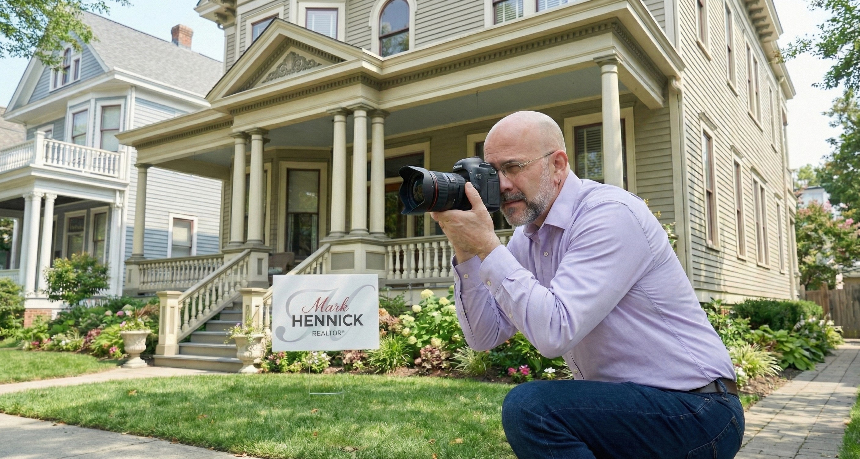Mark Hennick taking pictures in front of a beautiful New Orleans home