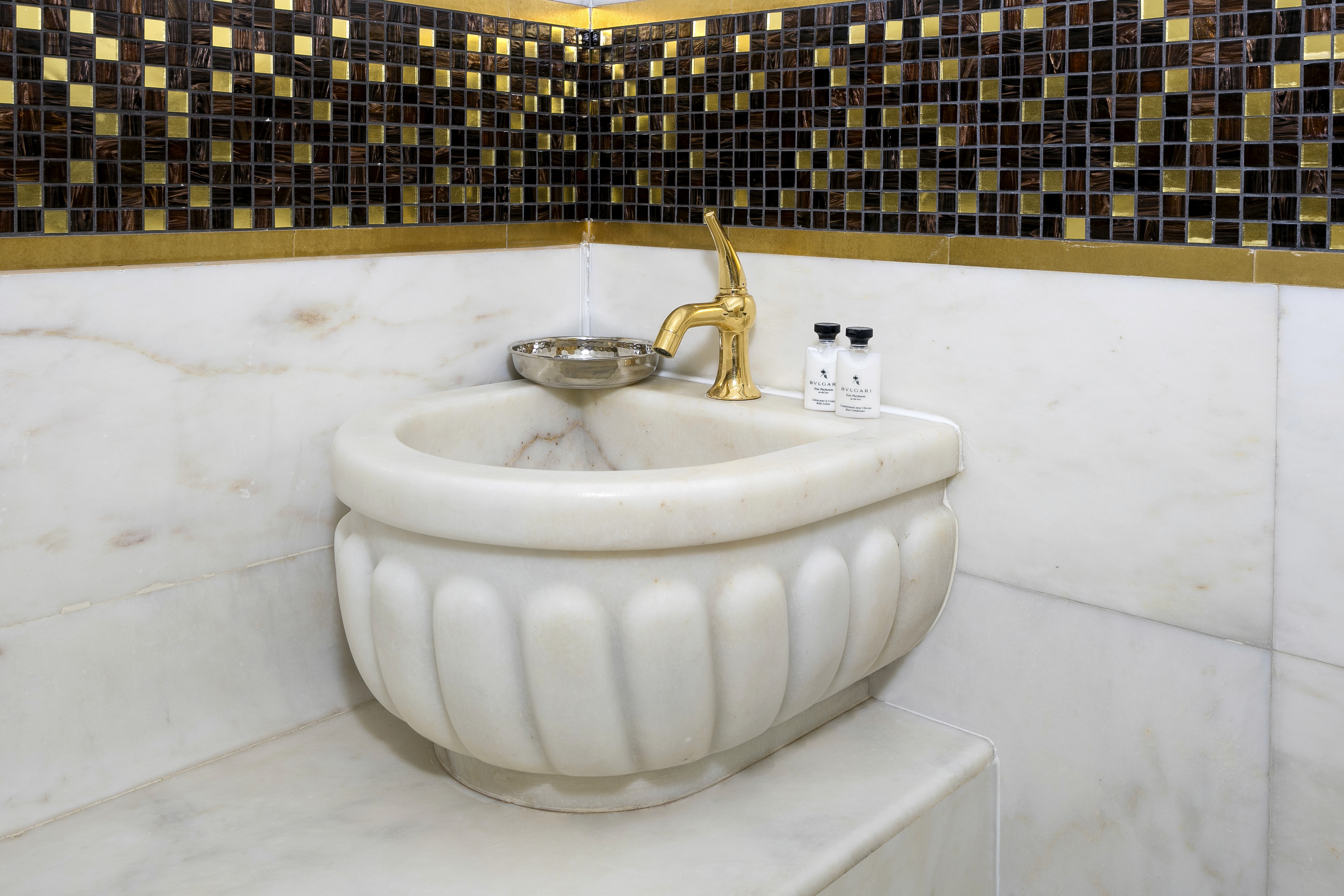 Jacuzzi detail showcasing a tranquil atmosphere, soft lighting, and a perfect setting to unwind after a long day.