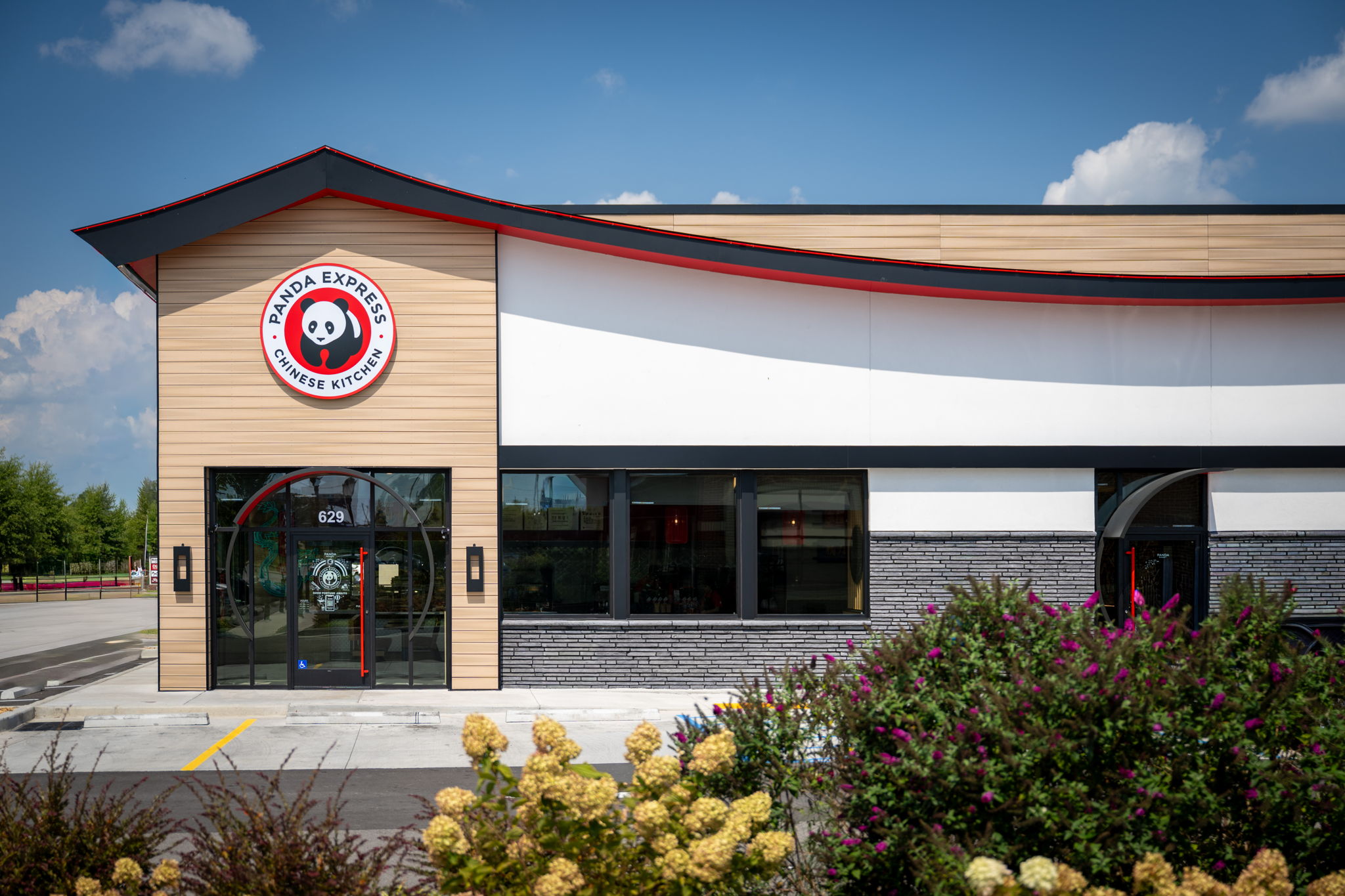 Turnkey commercial exterior for Panda Express featuring professional stone veneer masonry, EIFS/stucco finishes, and modern siding by Kith Exteriors.