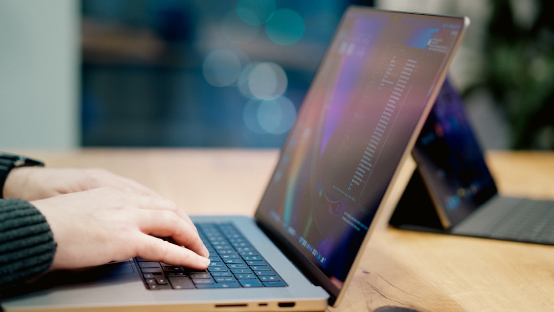 A person using a laptop to make a secure online payment for a court fine - collection agency for court fines