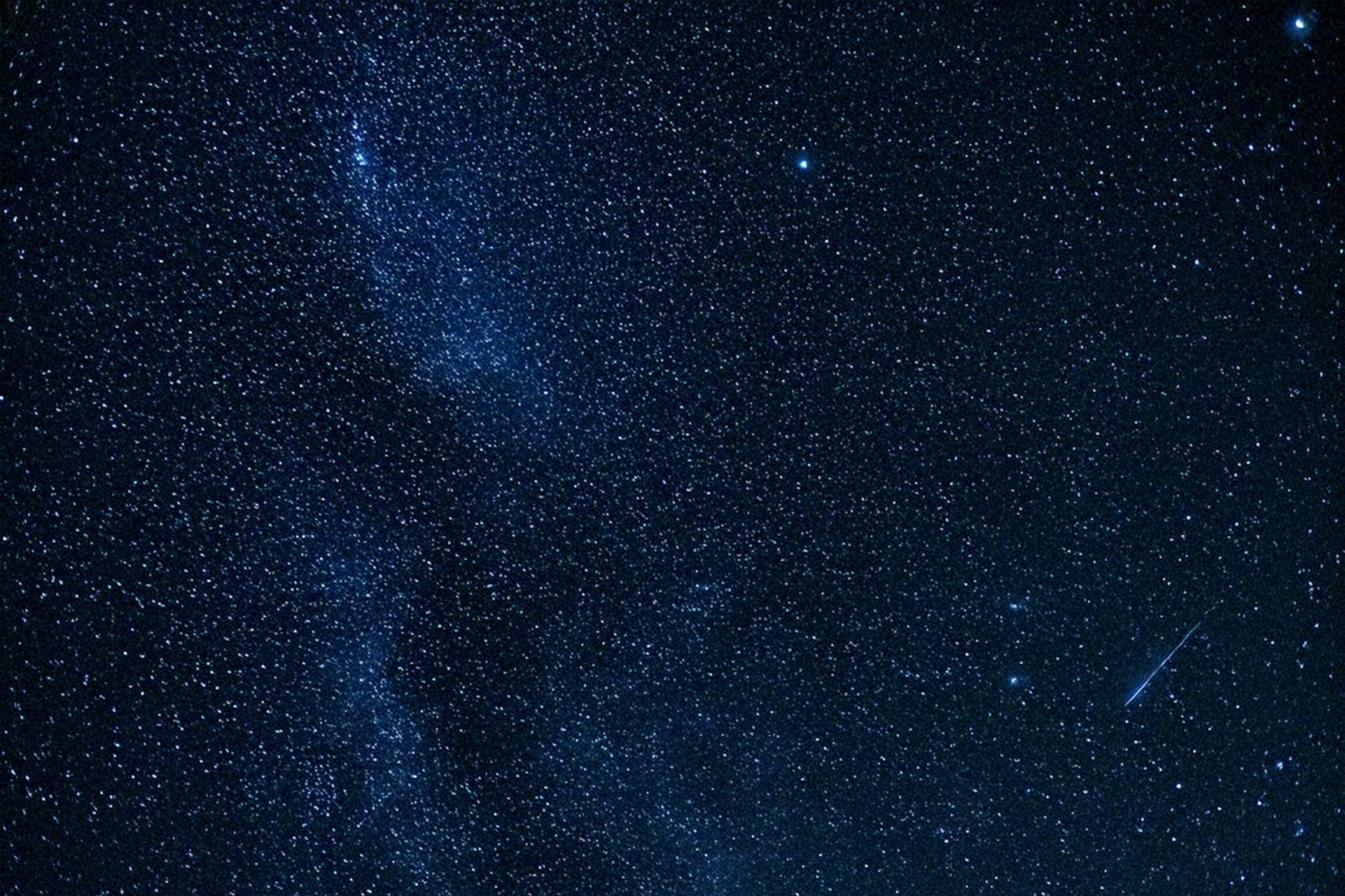 Bright stars scattered across a clear night sky