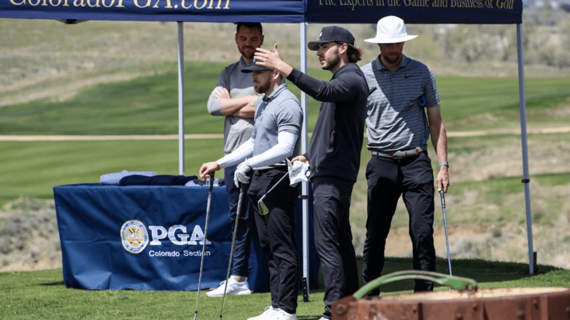 Jack and Jax discussing strategy on a golf course in front of a PGA canopy tent.