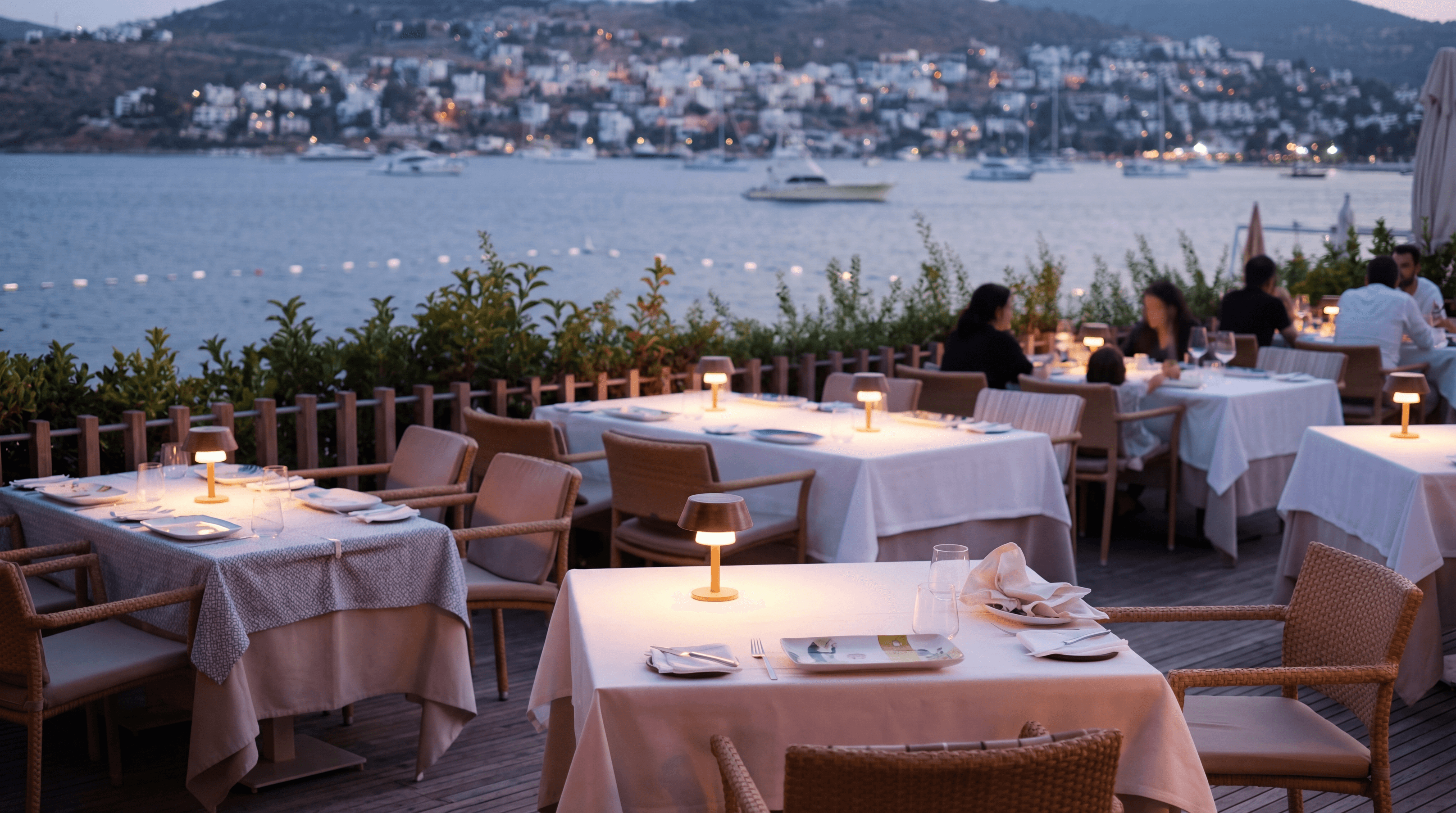 Luxury terrace dining overlooking the Bodrum Peninsula coastline in Türkbükü