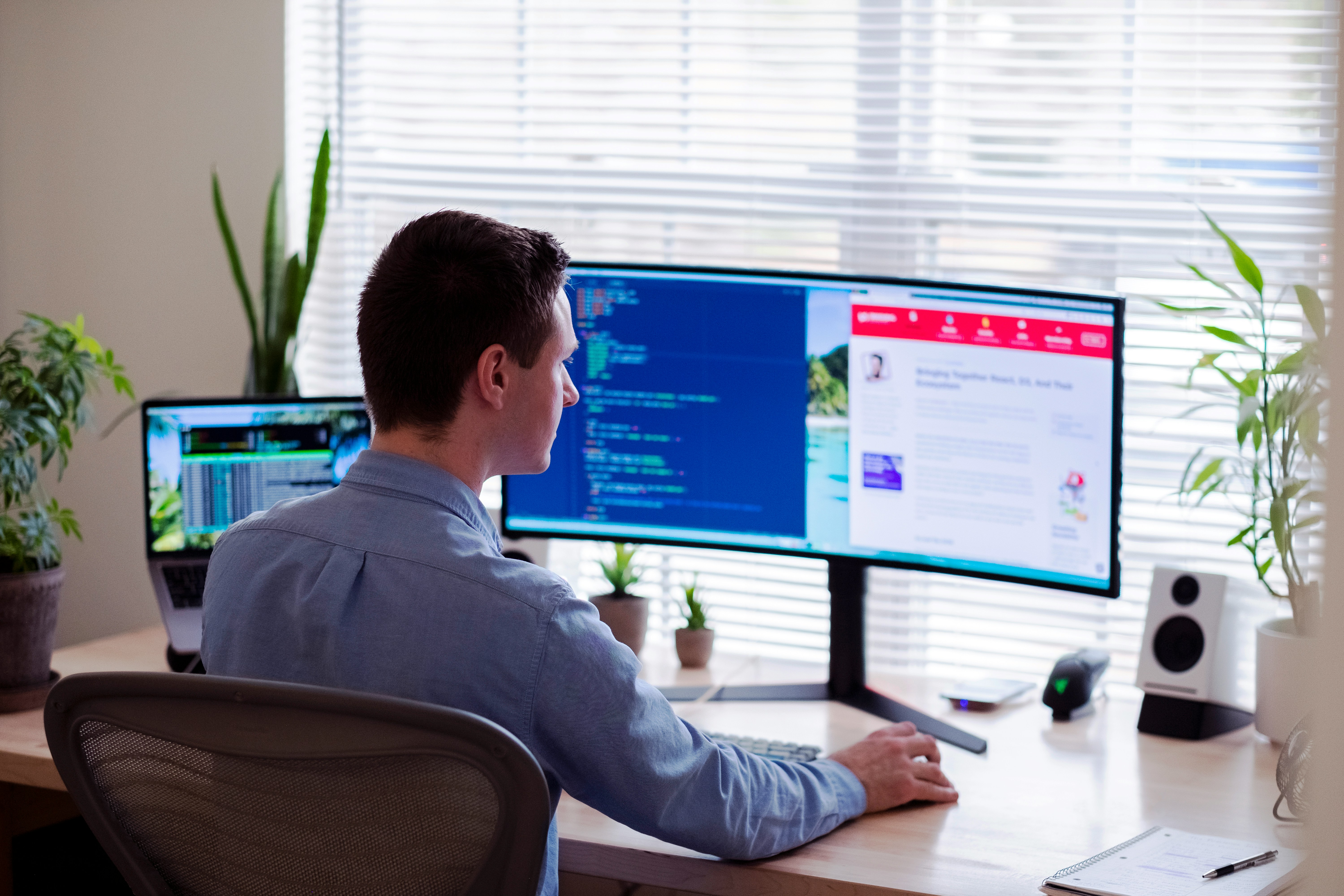 A Man sitting infront of his 2nd Screen