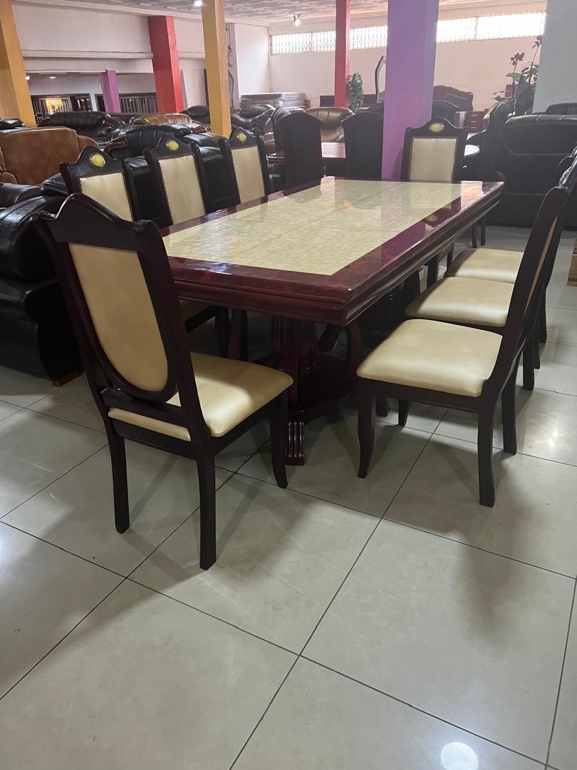 a gray couch with a wooden base on a gray background