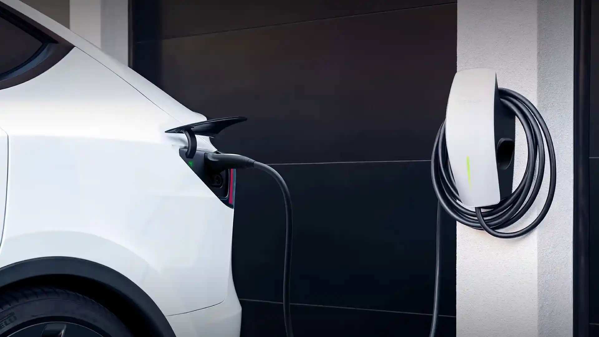 Tesla Wall Connector installed next to garage