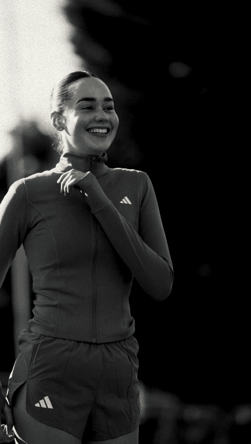 Couple embracing on street, bride's face obscured