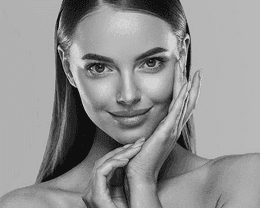 a woman sitting on a chair with her legs crossed