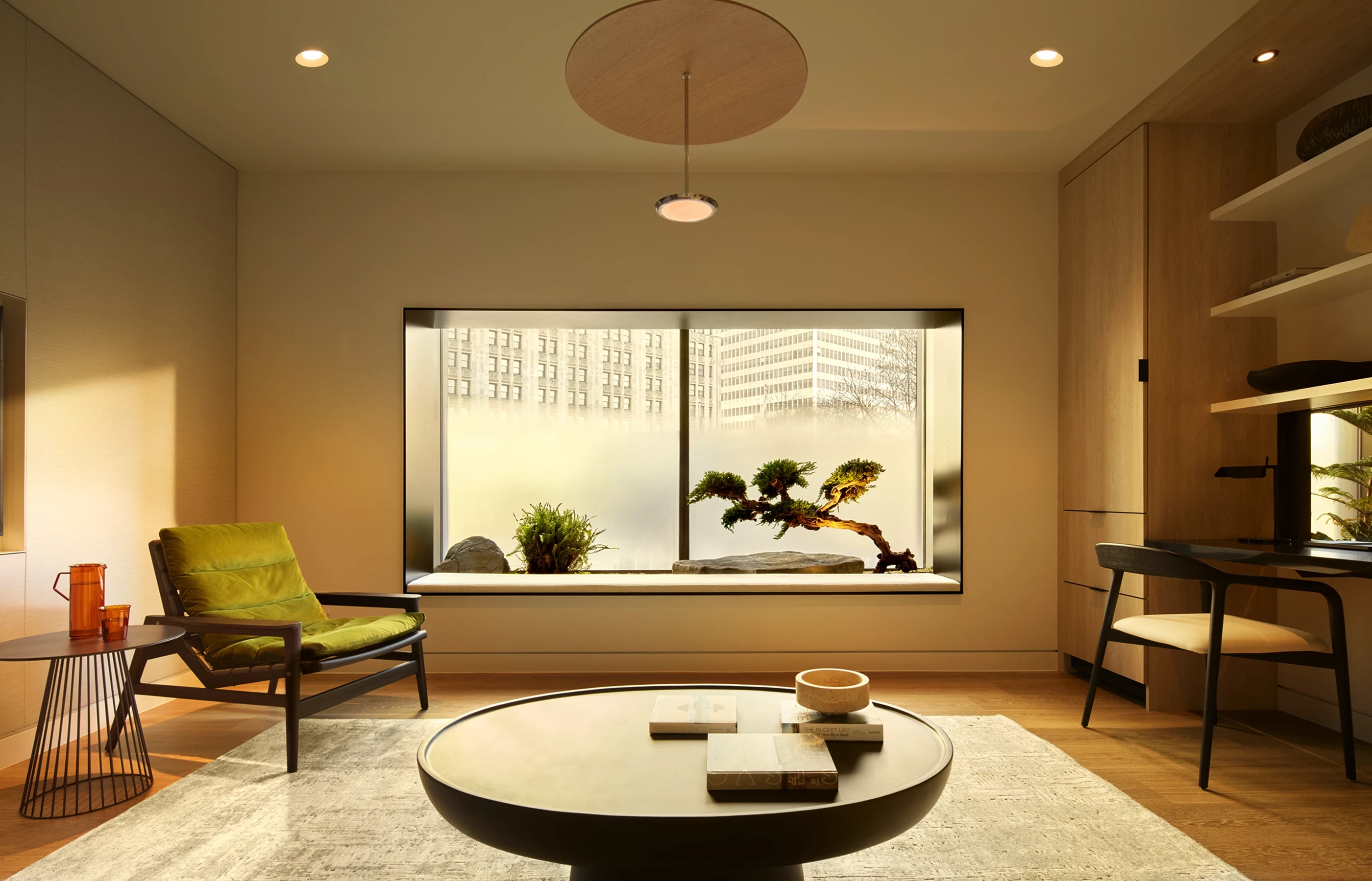 Private suite at Biograph New York with seating, city views, and garden landscaping for rest between health assessments.