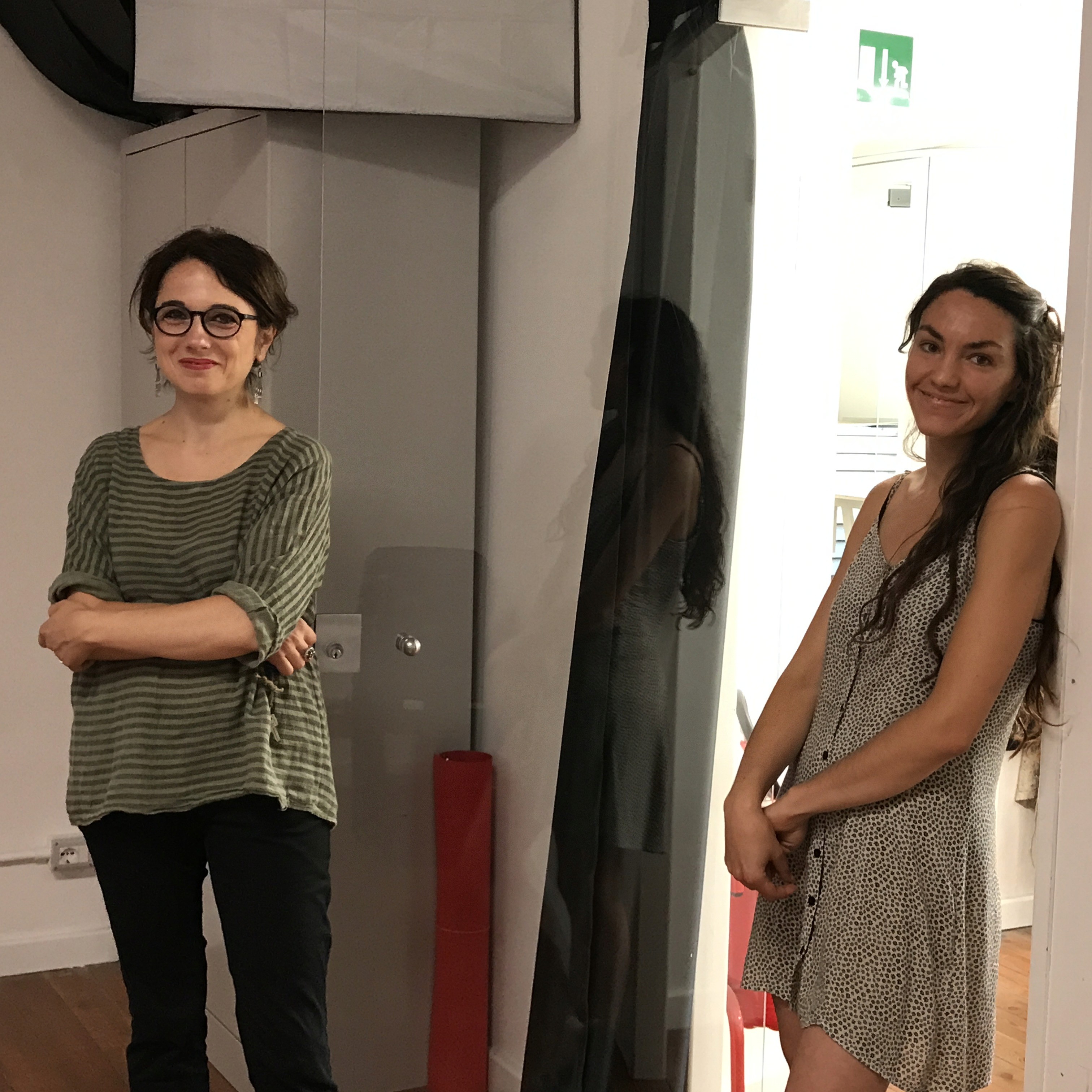 A photo of two girls smiling.