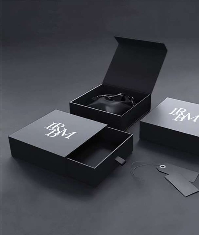 Aerial view of a winding road surrounded by dense green and yellow trees, showcasing nature’s vibrant colors.