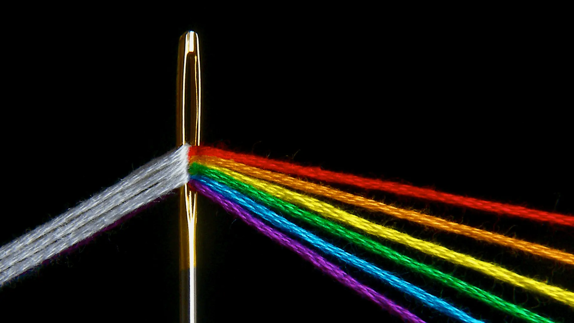 One white thread through the needle’s eye; a spectrum of strands on the other side.
