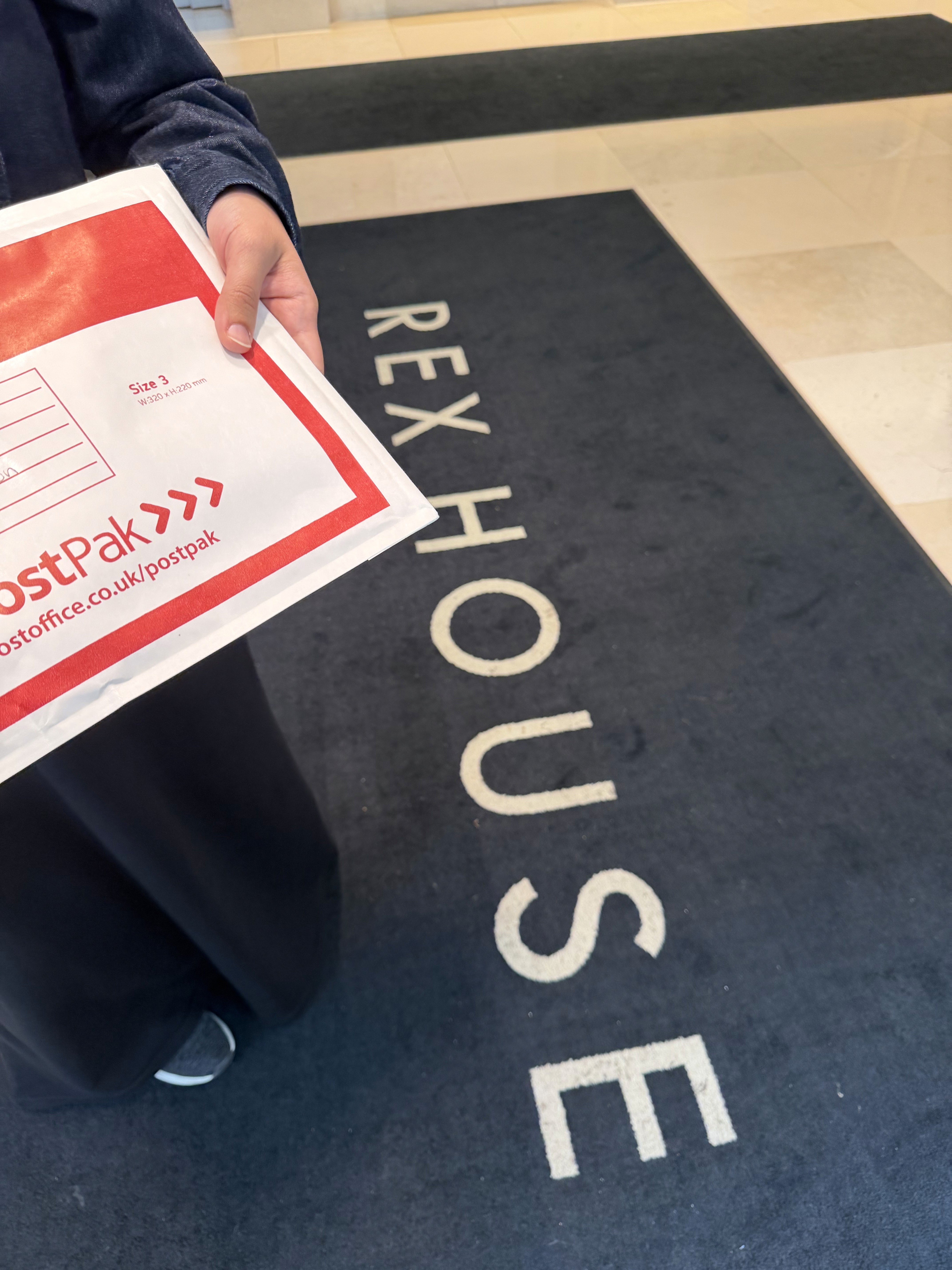 Perissology Courier handing over private business documents over to an executive