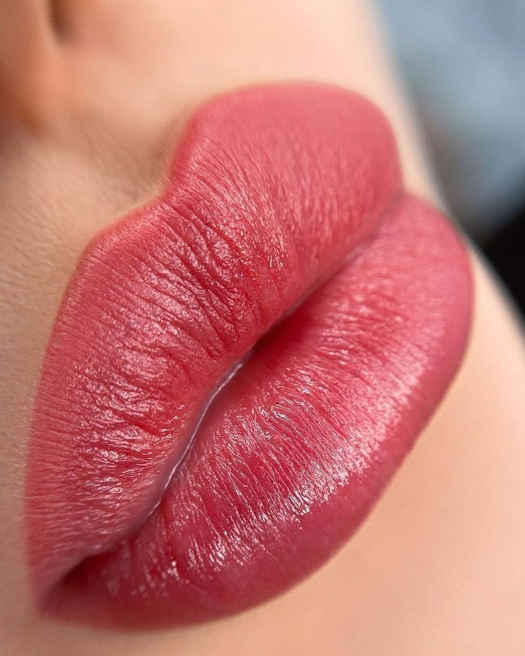 Crop view of female lips, after the procedure