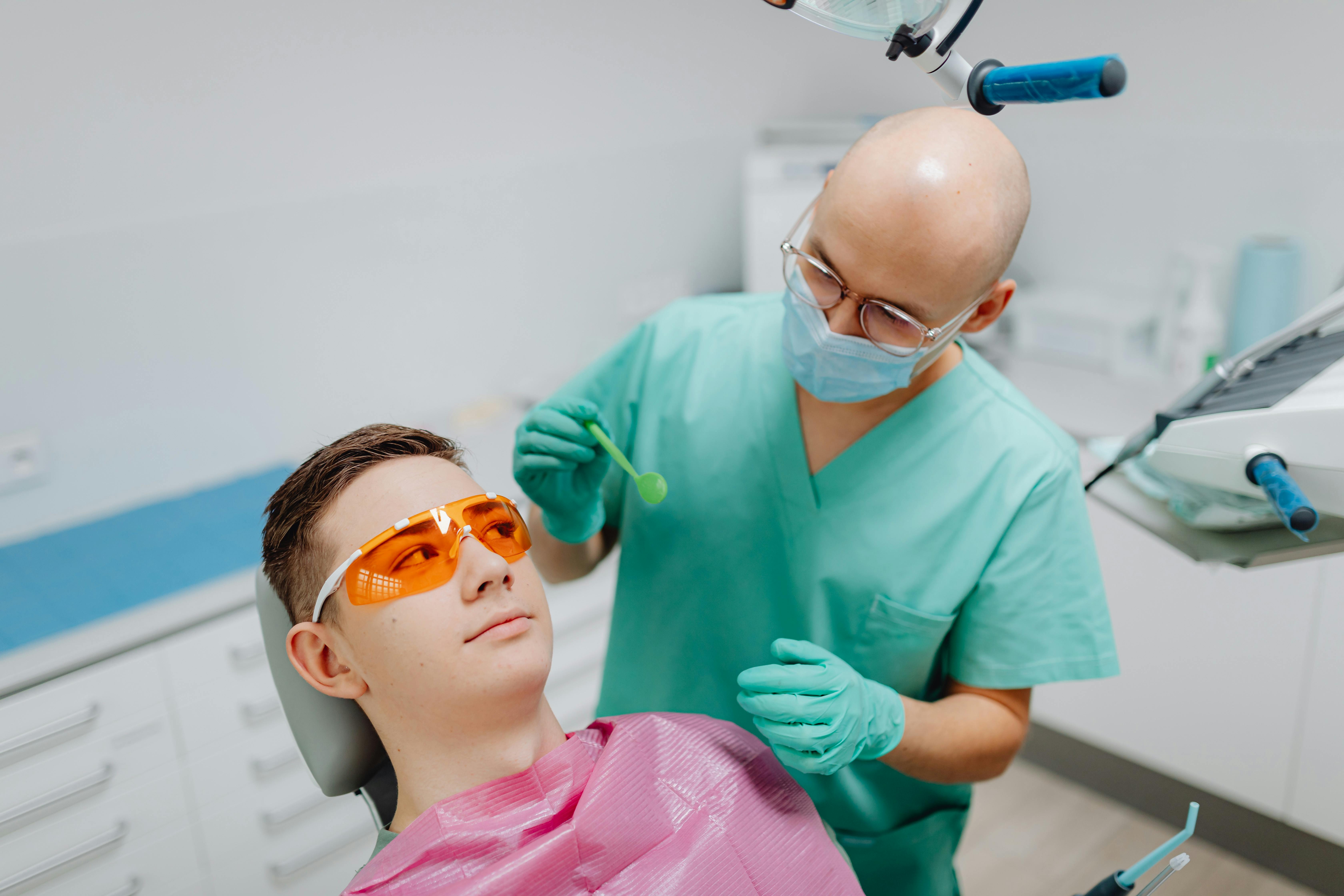 Dental hygienist working on patient