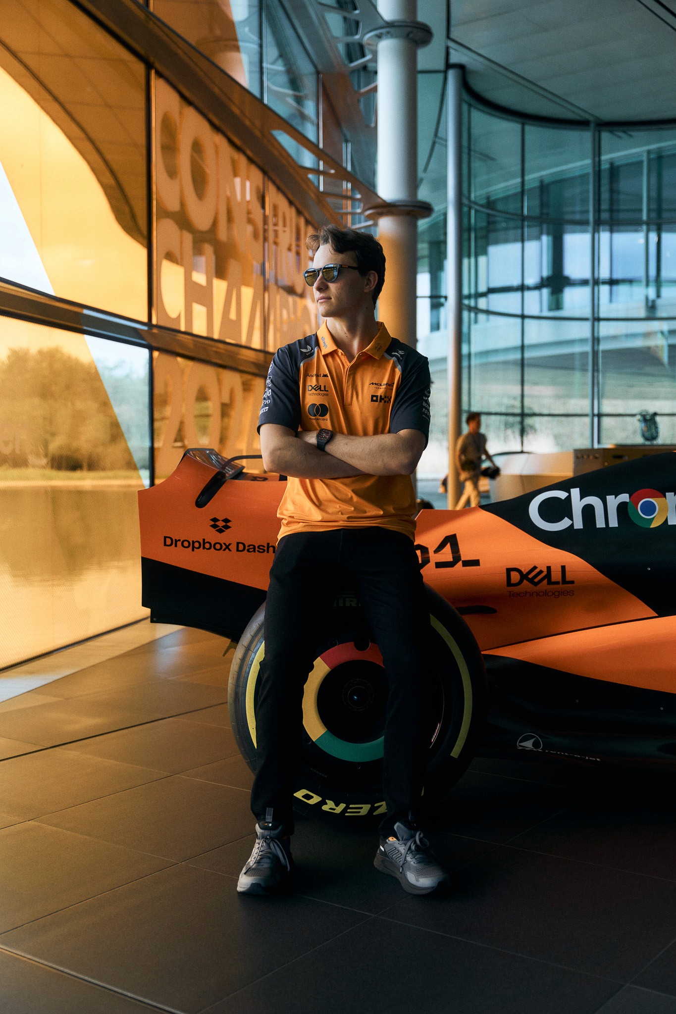 Two models standing side by side in a golden wheat field.