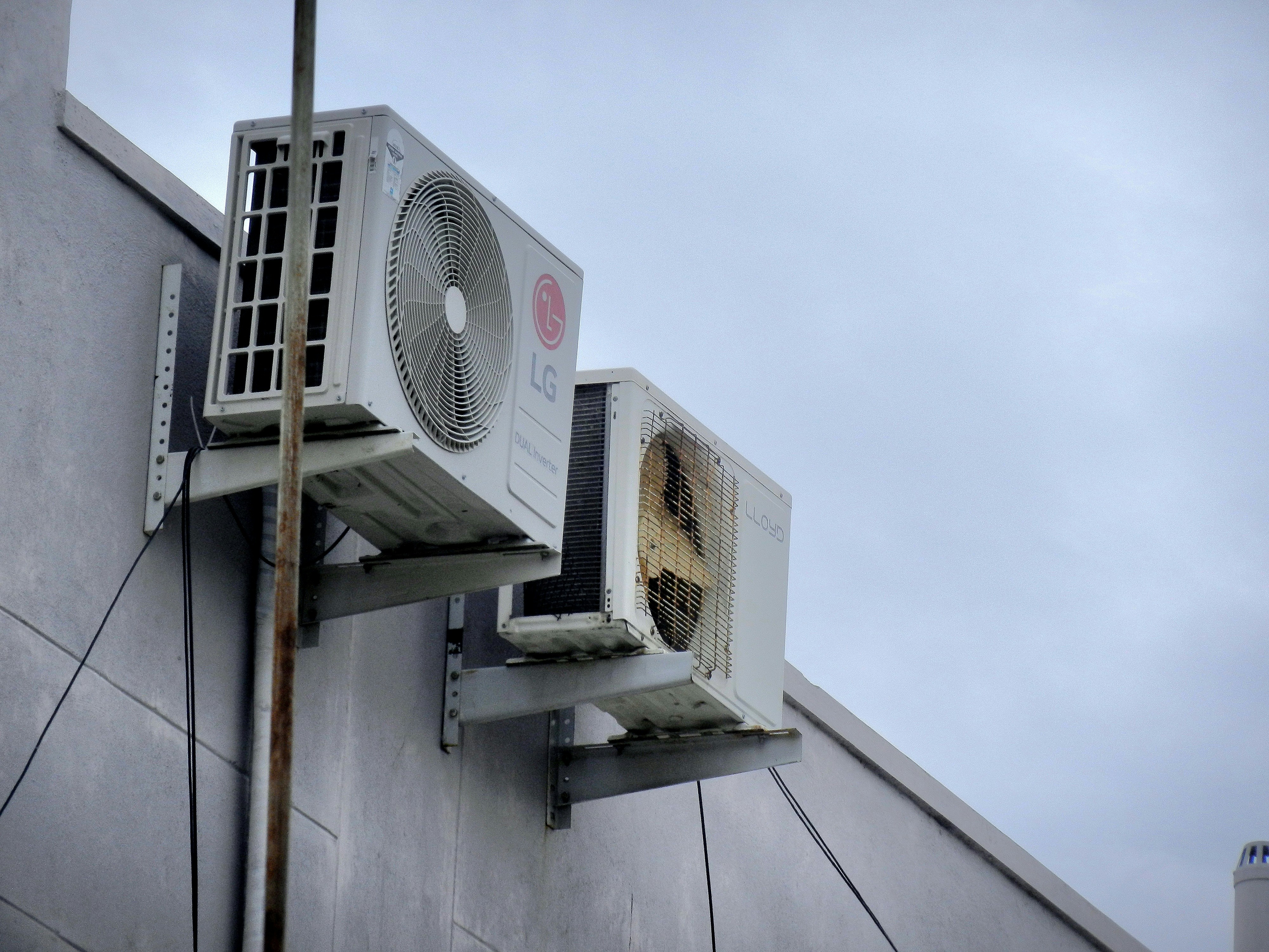 An air conditioner mounted to the side of a building