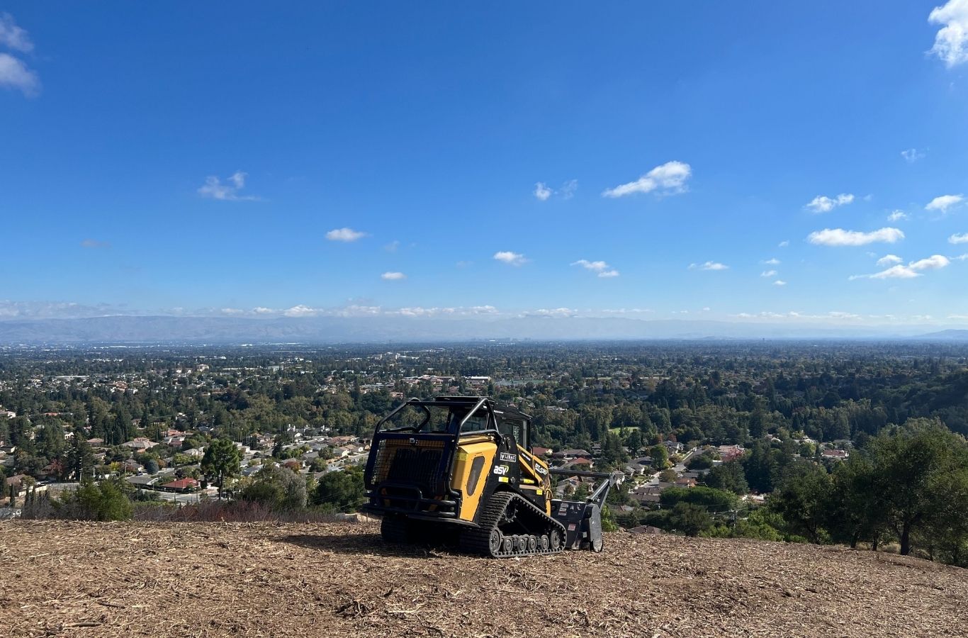 Lisac General Engineering team clearing dense forest vegetation in La Honda, CA with advanced machinery for efficient land preparation.