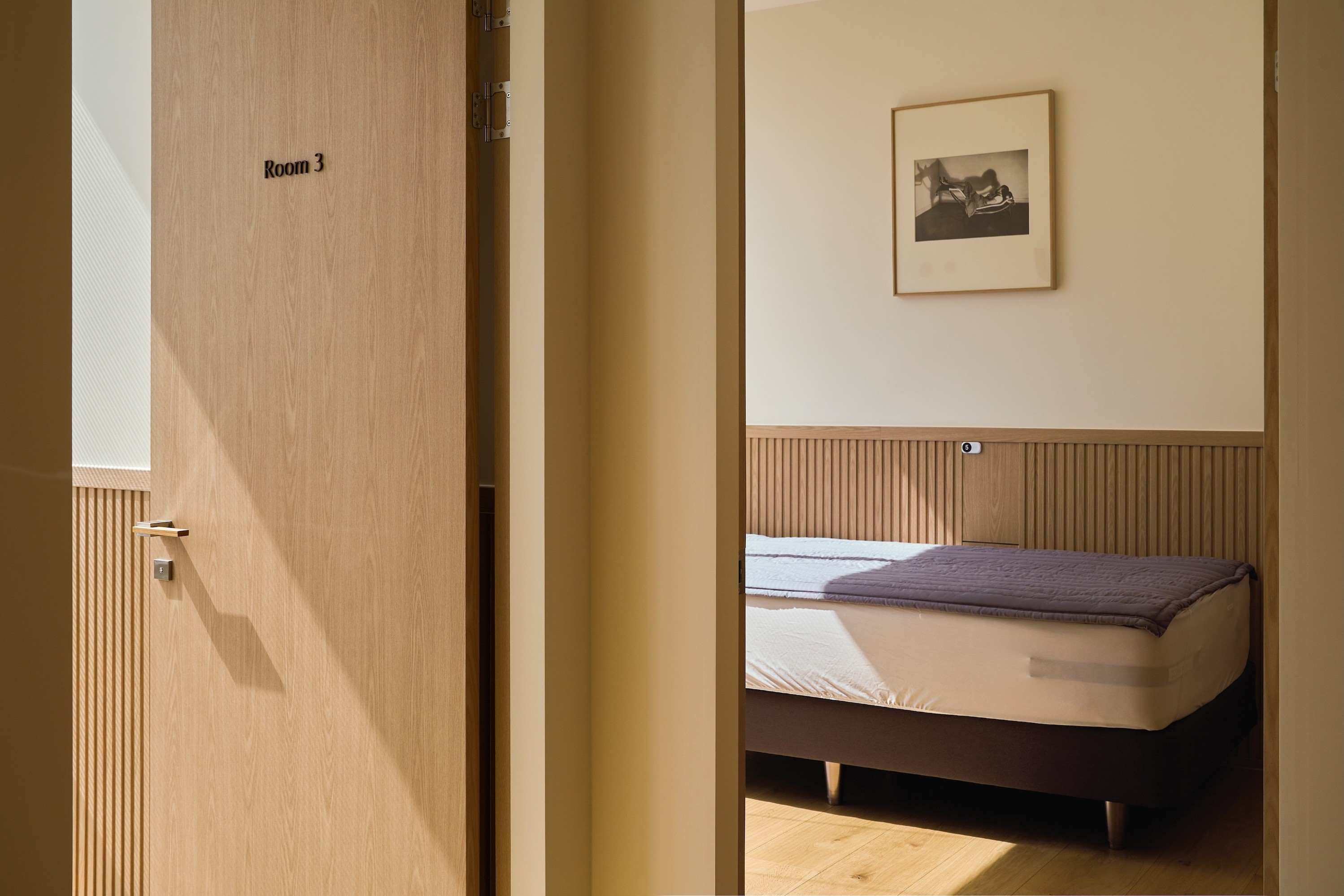 a room with comfy bed