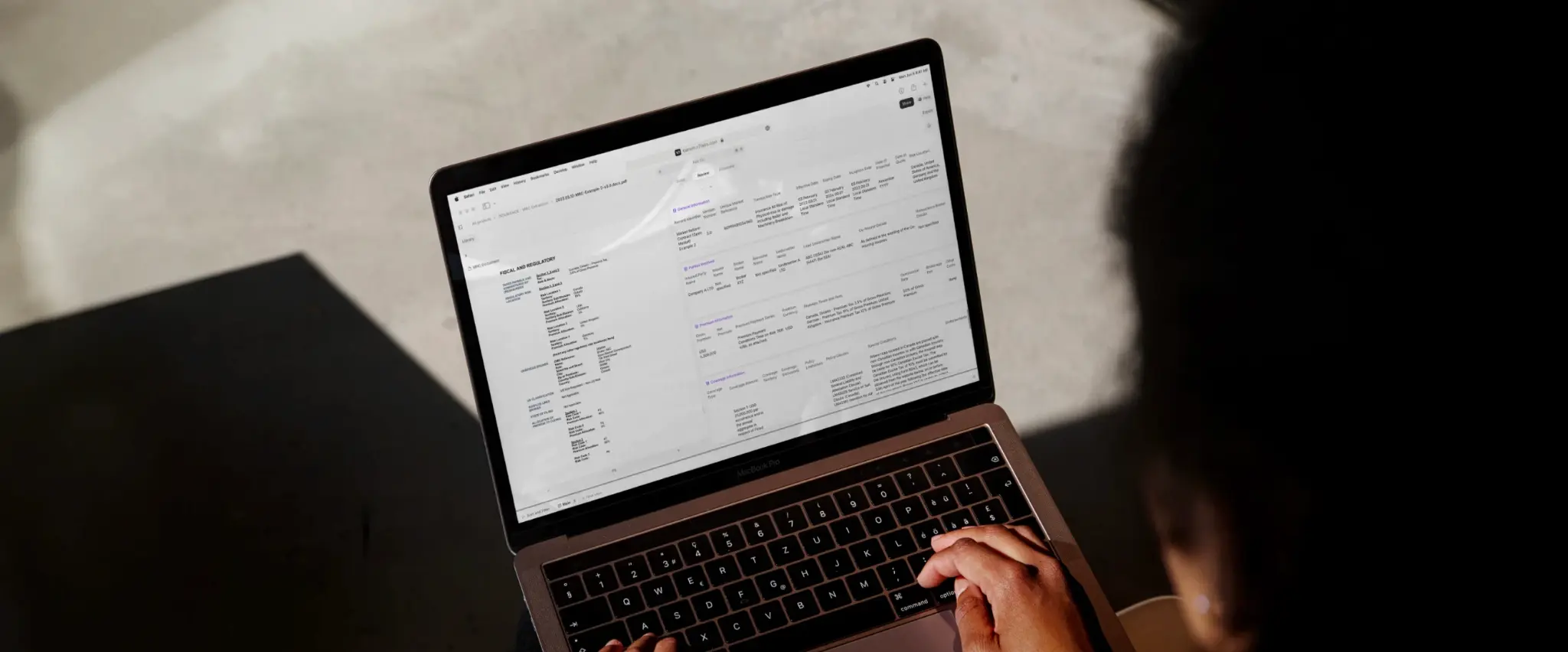 Laptop screen showing financial and regulatory information.
