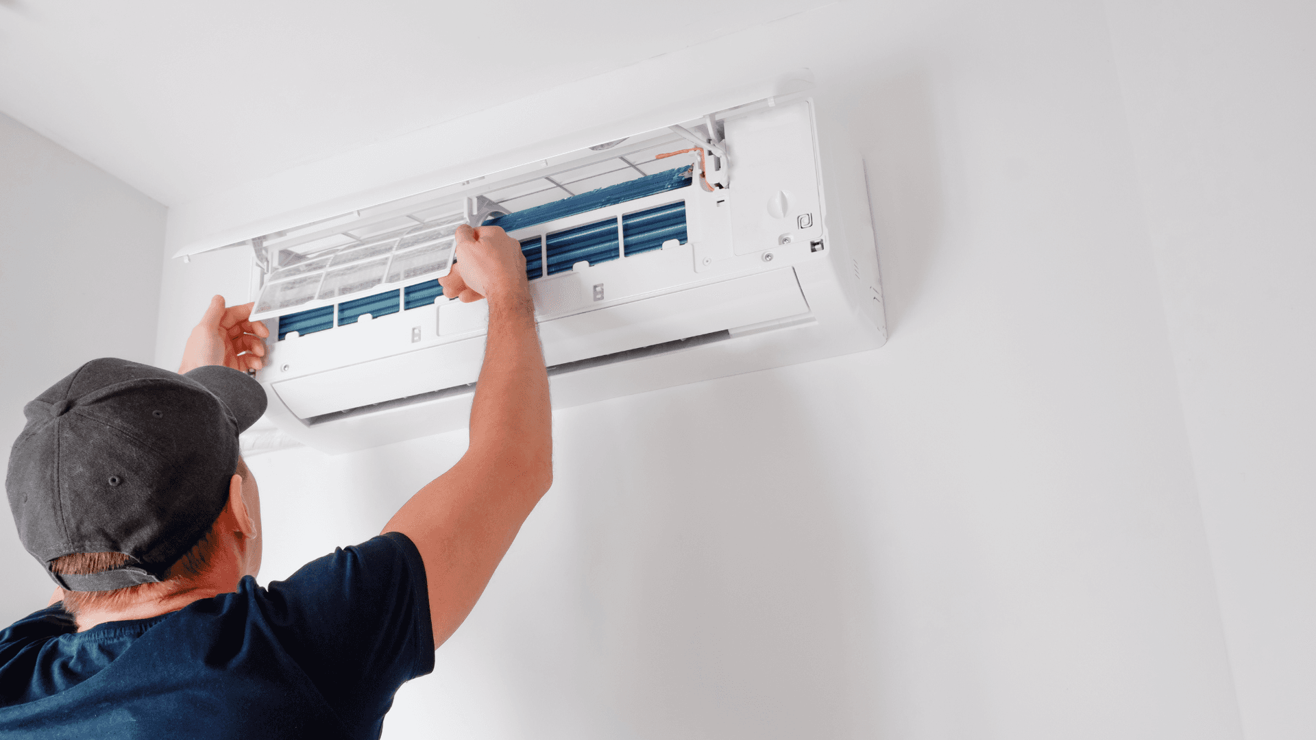 man fixing hvac fan