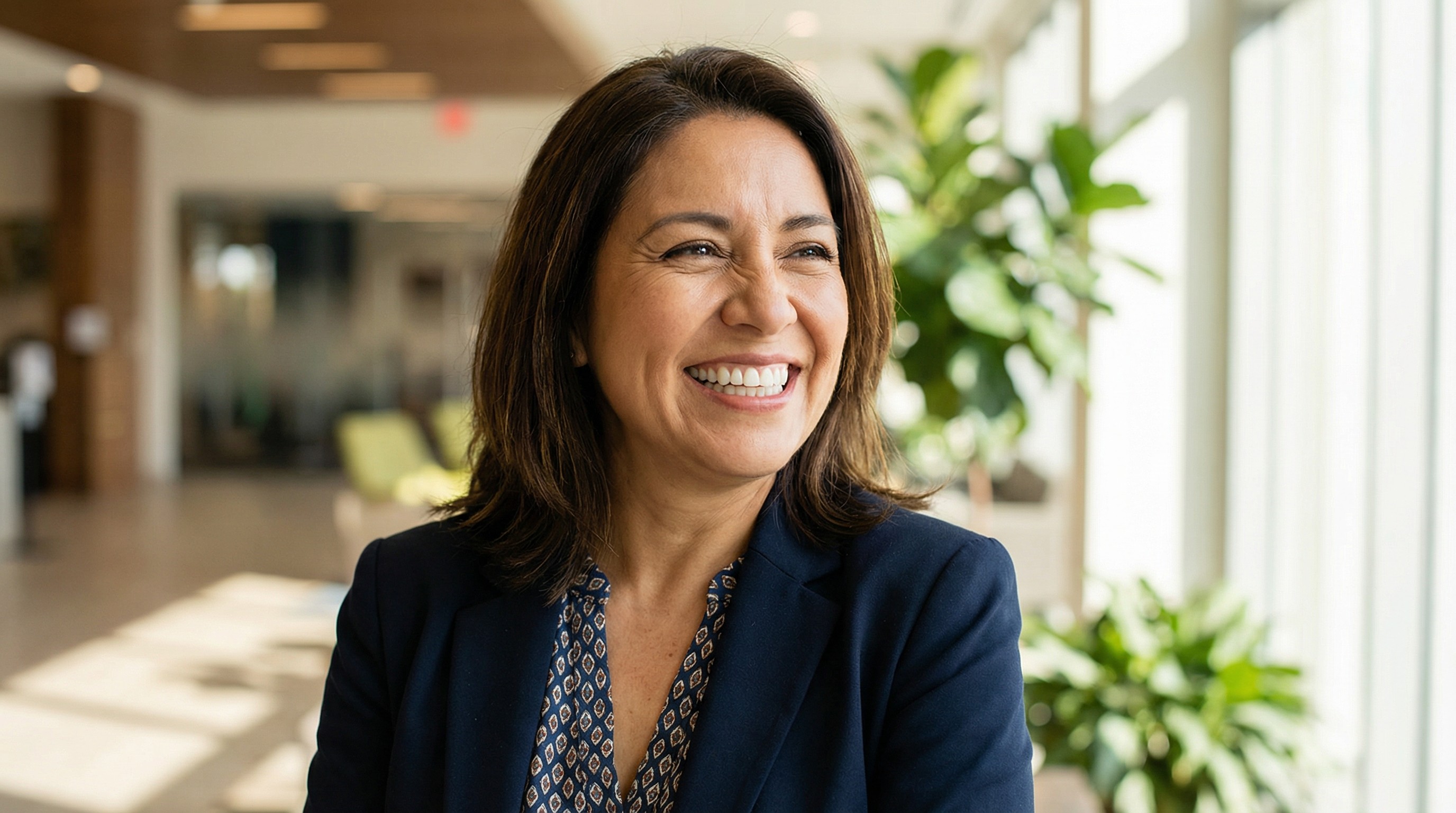 Confident, happy patient displaying beautiful smile after comprehensive smile makeover treatment at Veda Family Dentistry, showing increased confidence and life satisfaction.