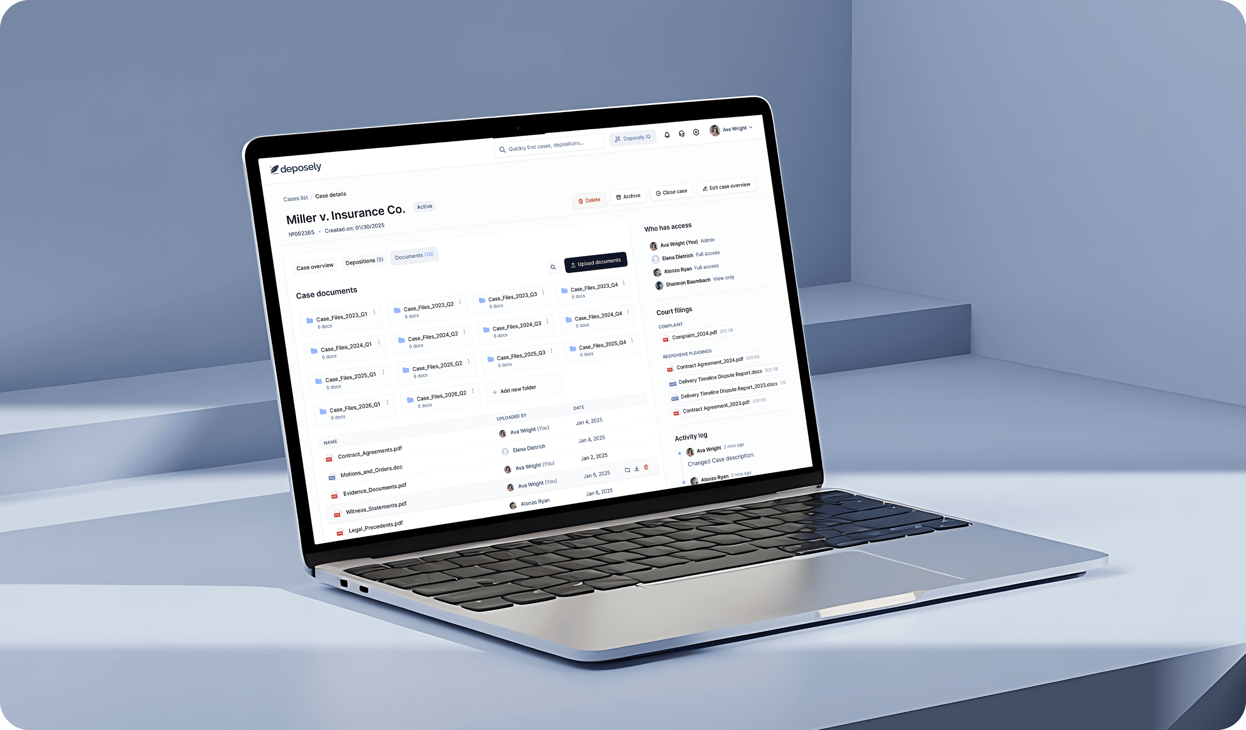 A laptop on a light blue surface displaying a digital interface or application screen.