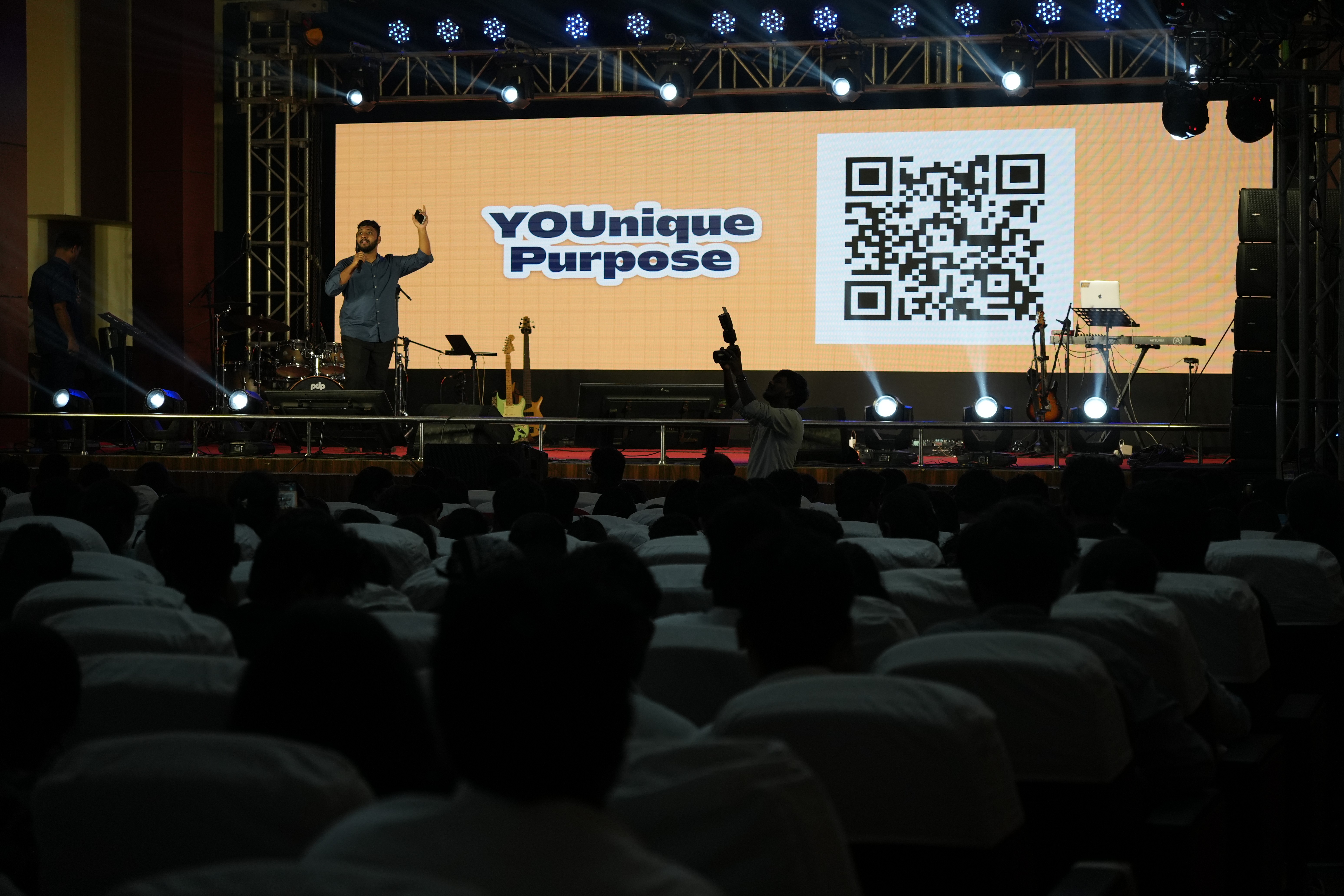 A group of people standing around each other