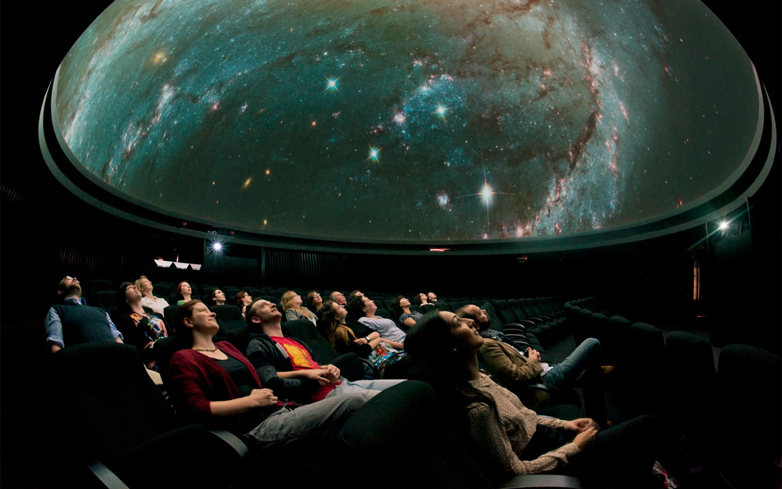 Royal Observatory Planetarium interior with starry dome and seating arrangement.