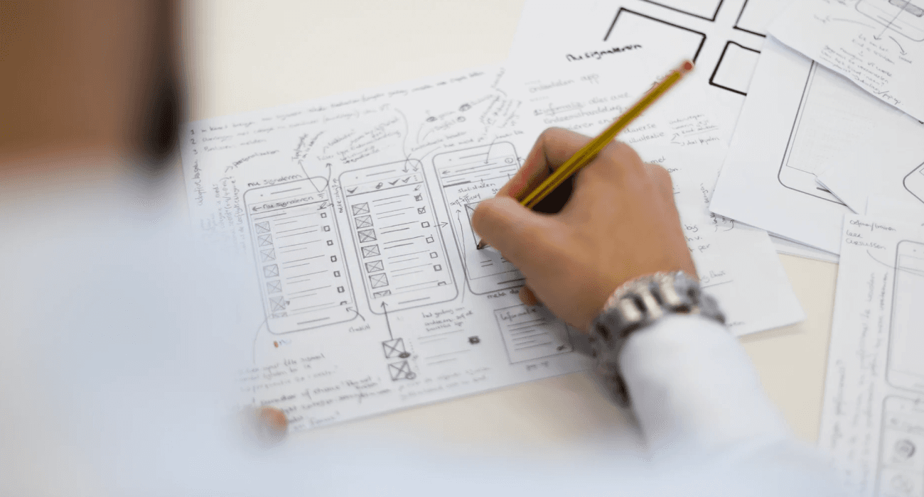 Documents and planning materials on a desk, representing customized solutions tailored to client needs.