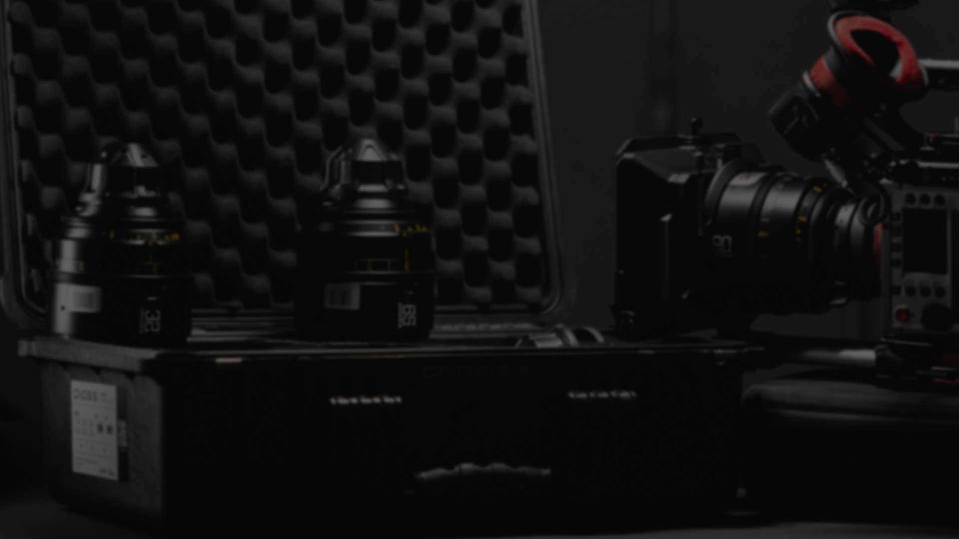 Close-up of camera buttons and dials, monochrome.