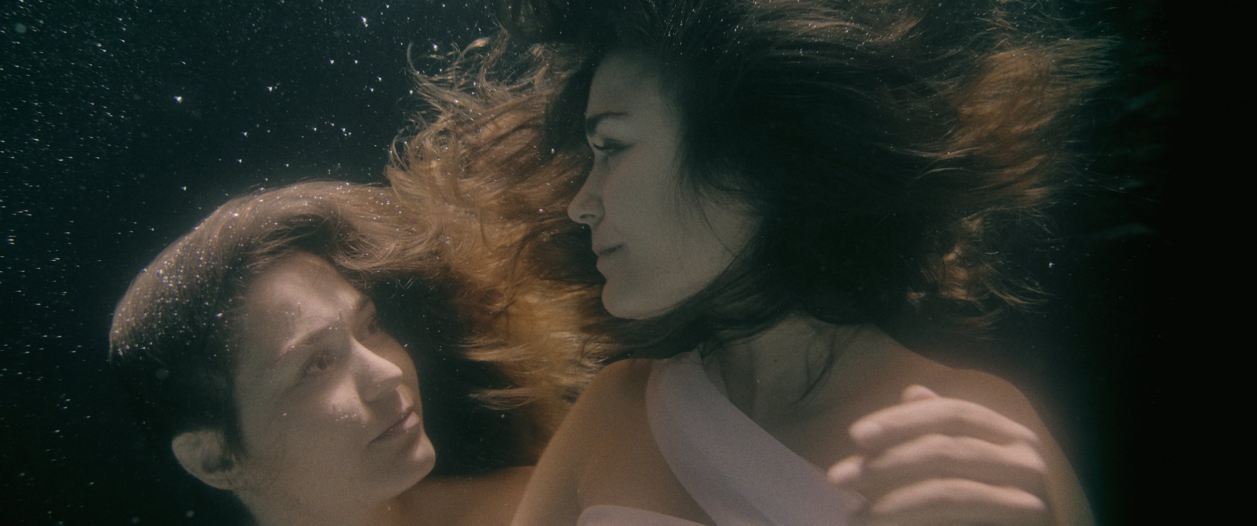 Streetside billboard with flyposters of the Batch.Works brand and illustrations