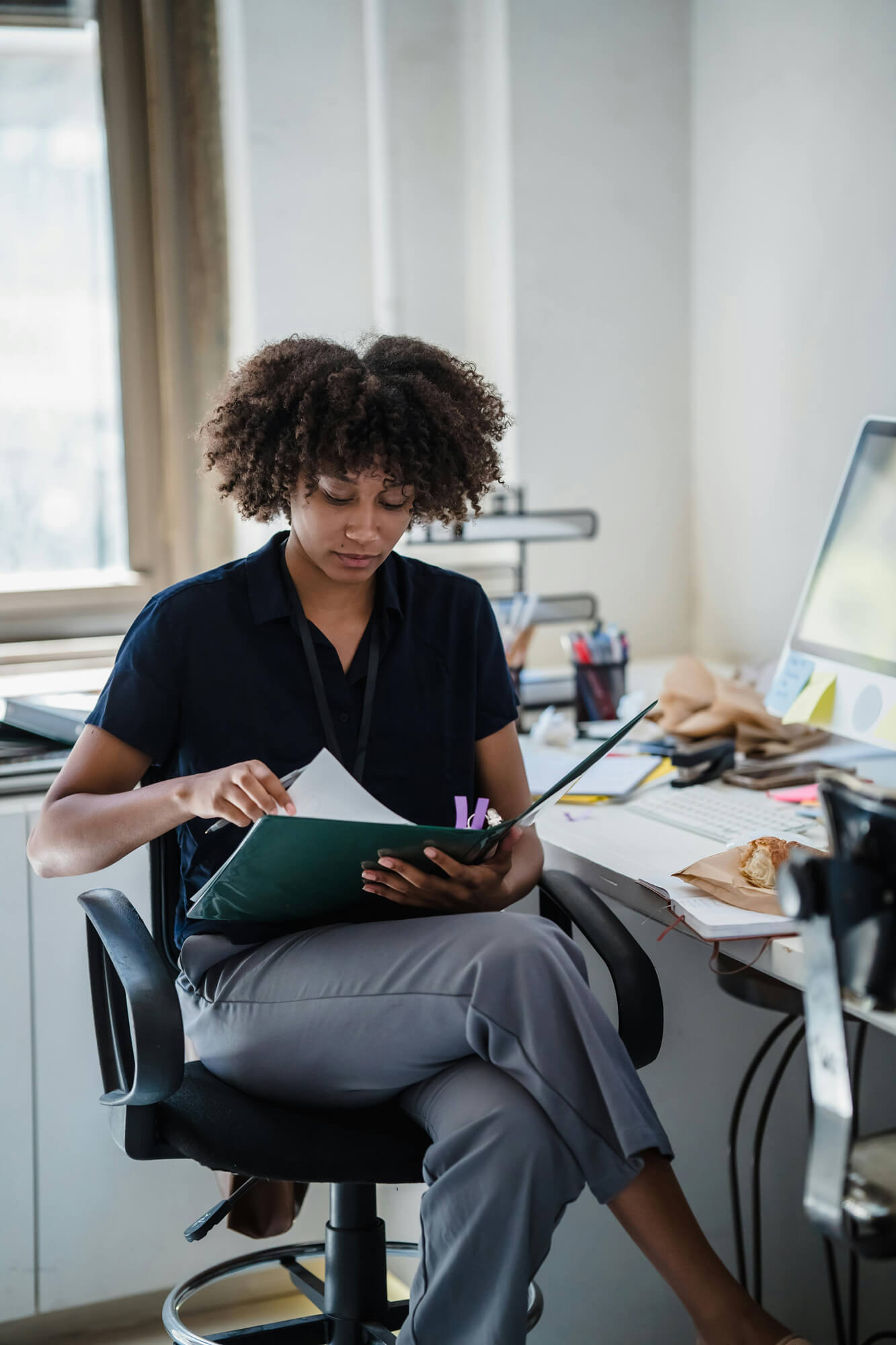 A lady reading a report