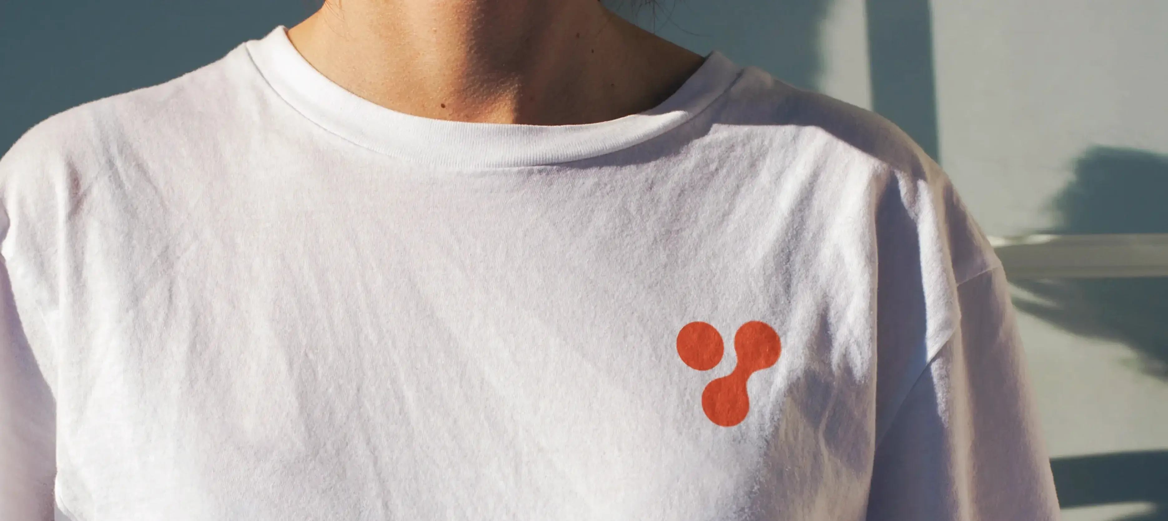 Y-LOT Foundation brand application – overlapping geometric shapes in warm gradient palette for digital and print materials by Teatime Studio.