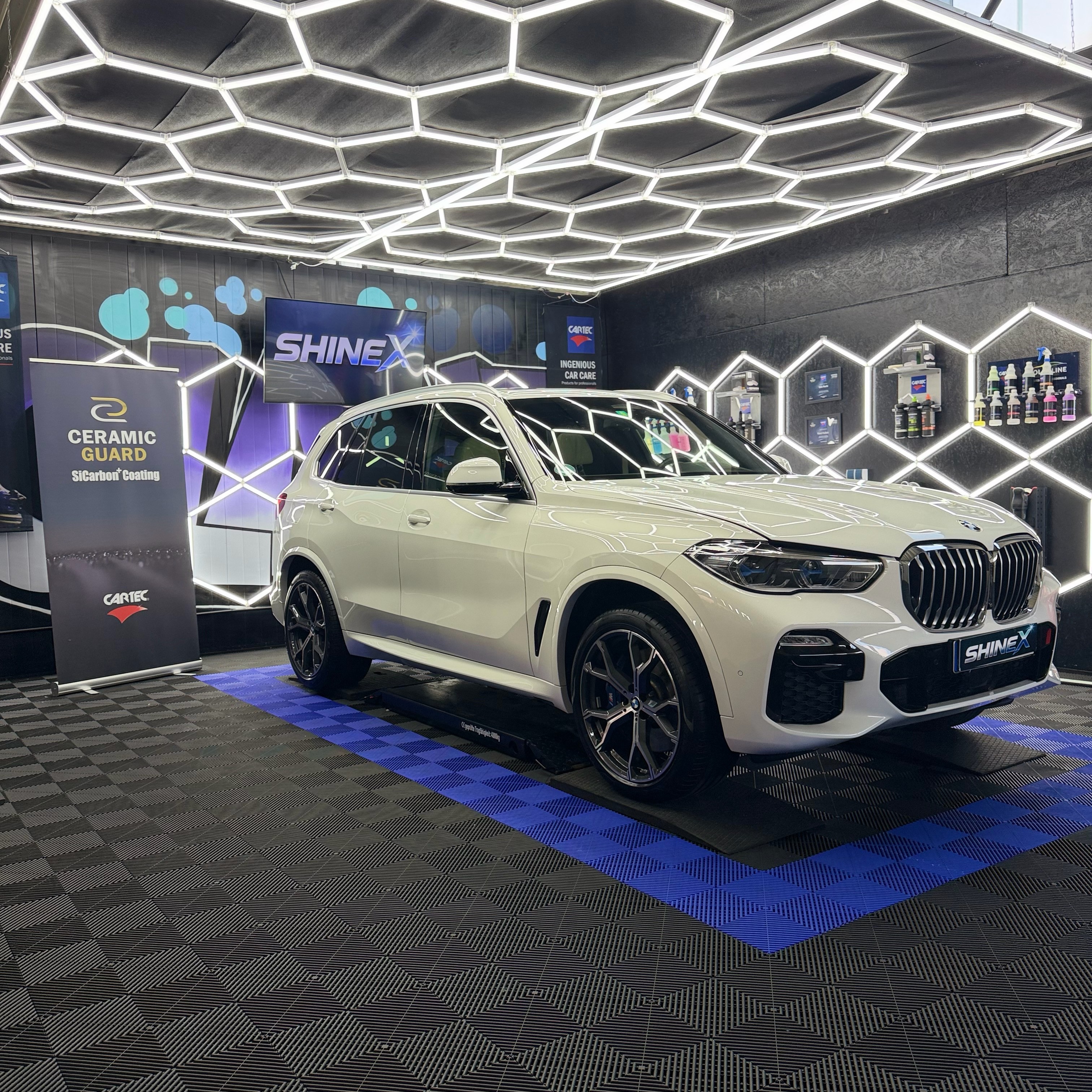 White BMW exterior with studio light reflections