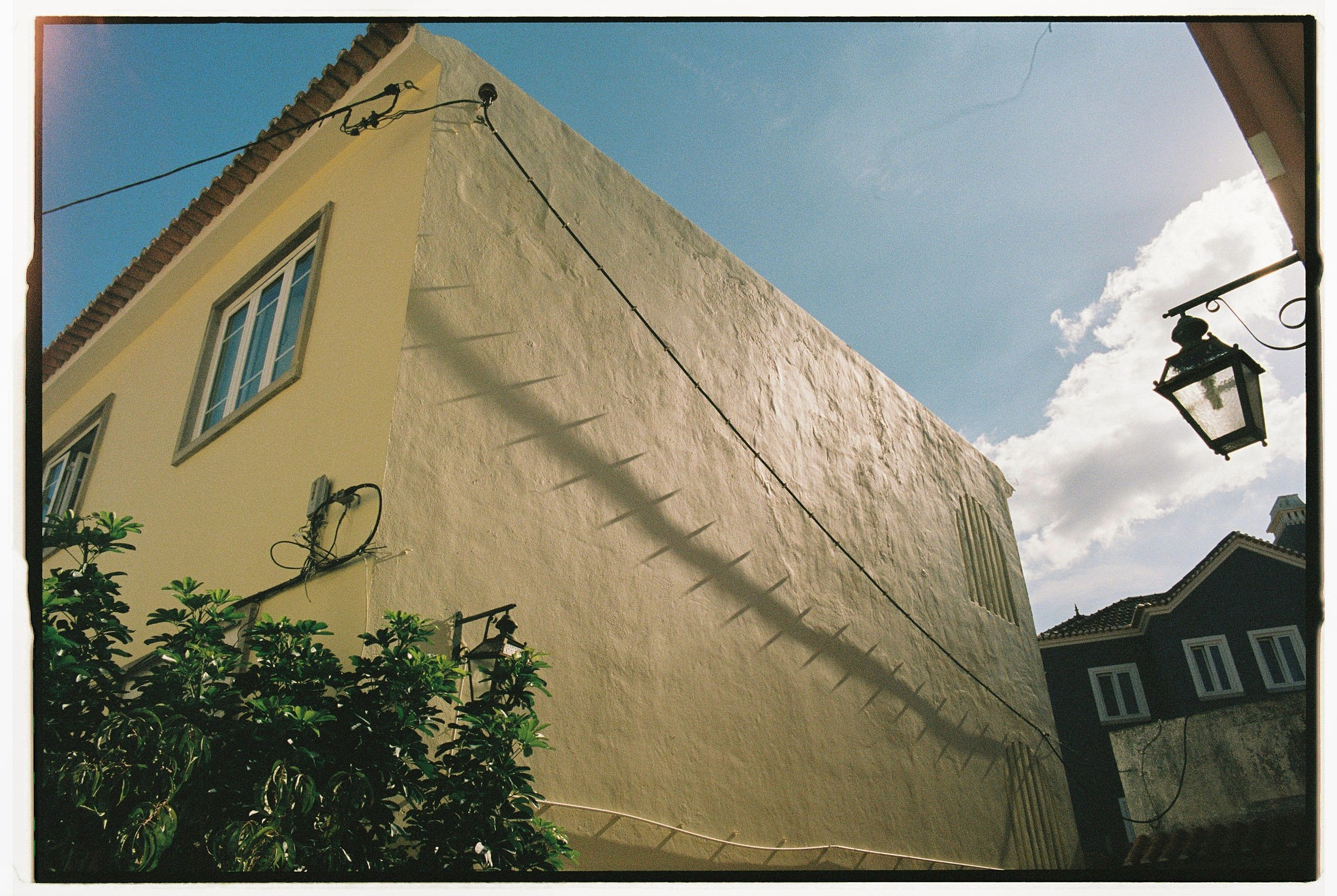 Modern skyscrapers line a busy highway in a sprawling city.