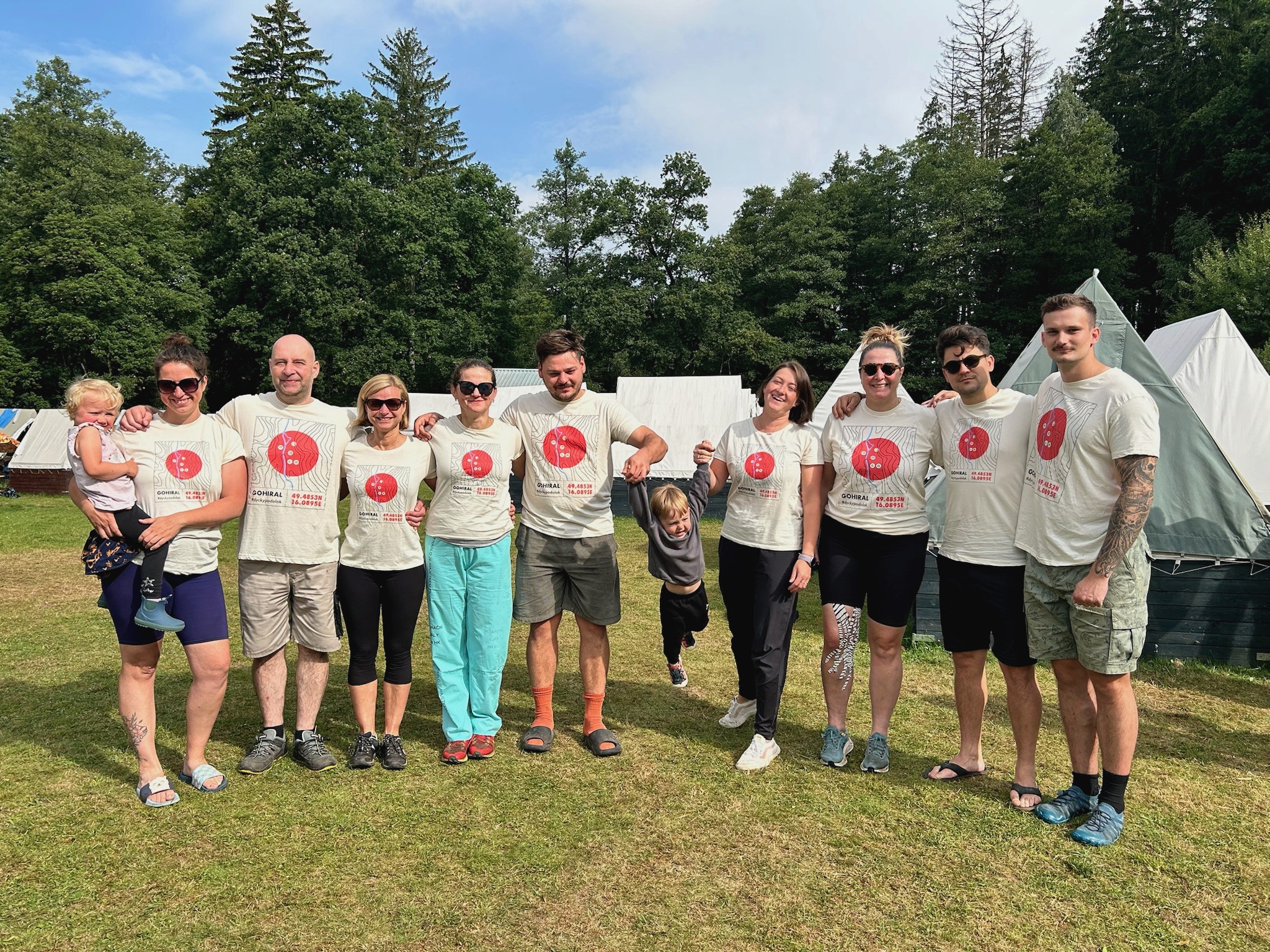 two people in a workspace working on their laptops