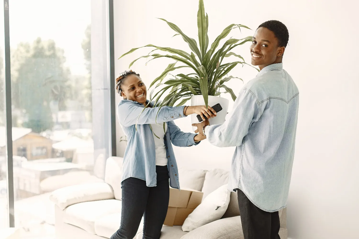 Close‑up of a couple’s feet walking along a wooden garden path with a stroller, symbolising how FHA financing makes homeownership feel within reach.