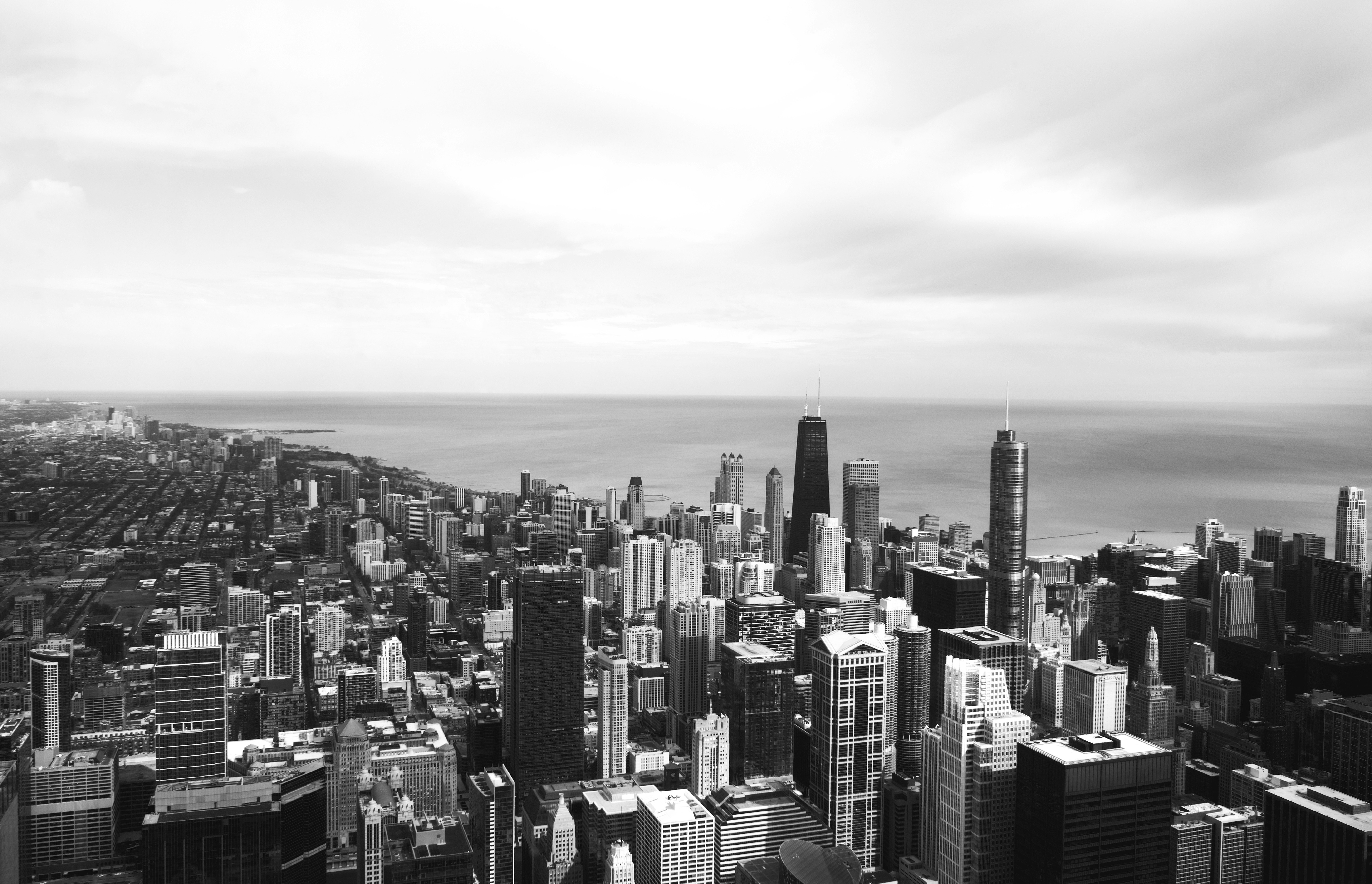grayscale photo of city buildings