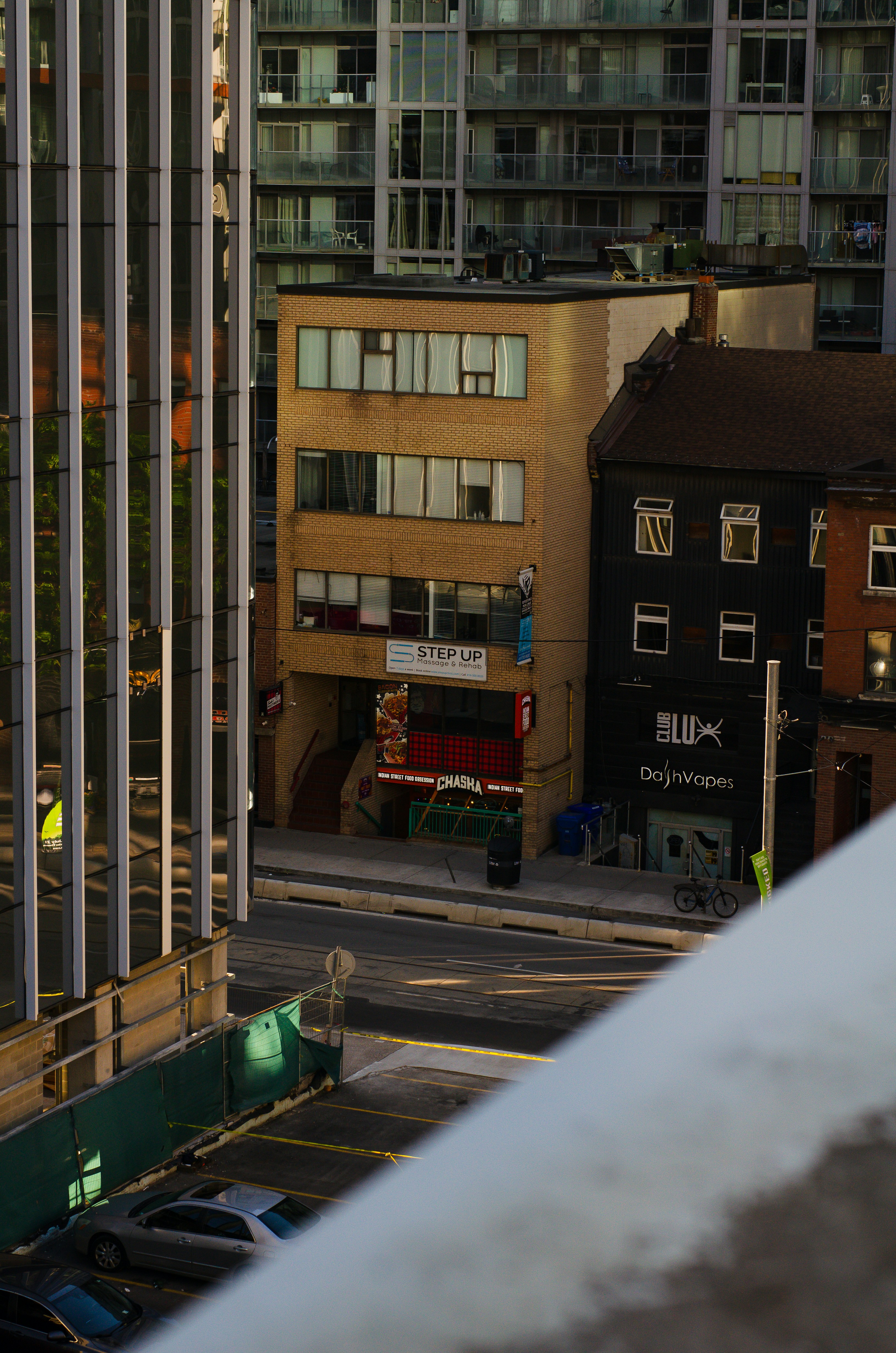 a view of a city street from a high rise building