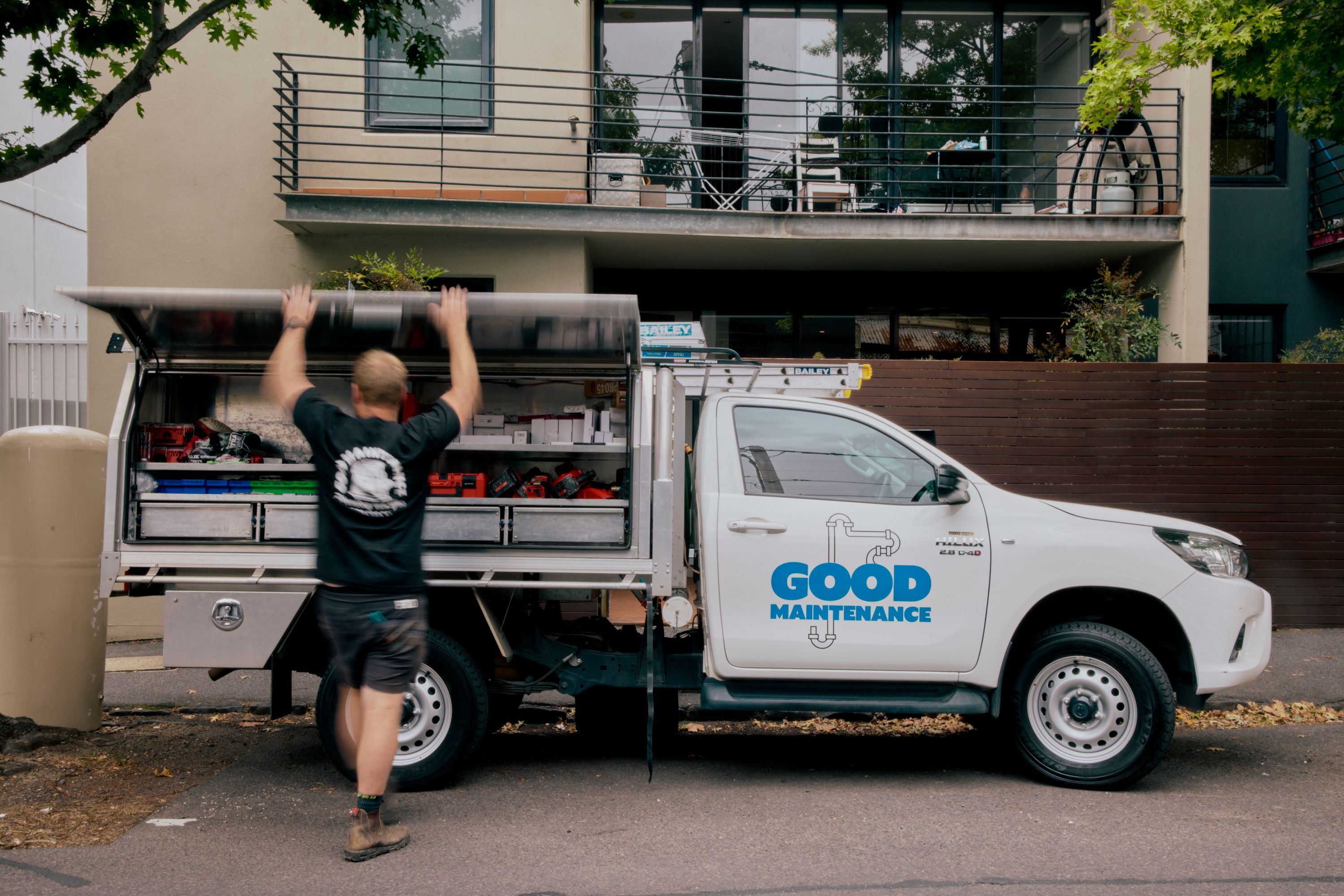 Good Maintenance Technician looking at tools in company van