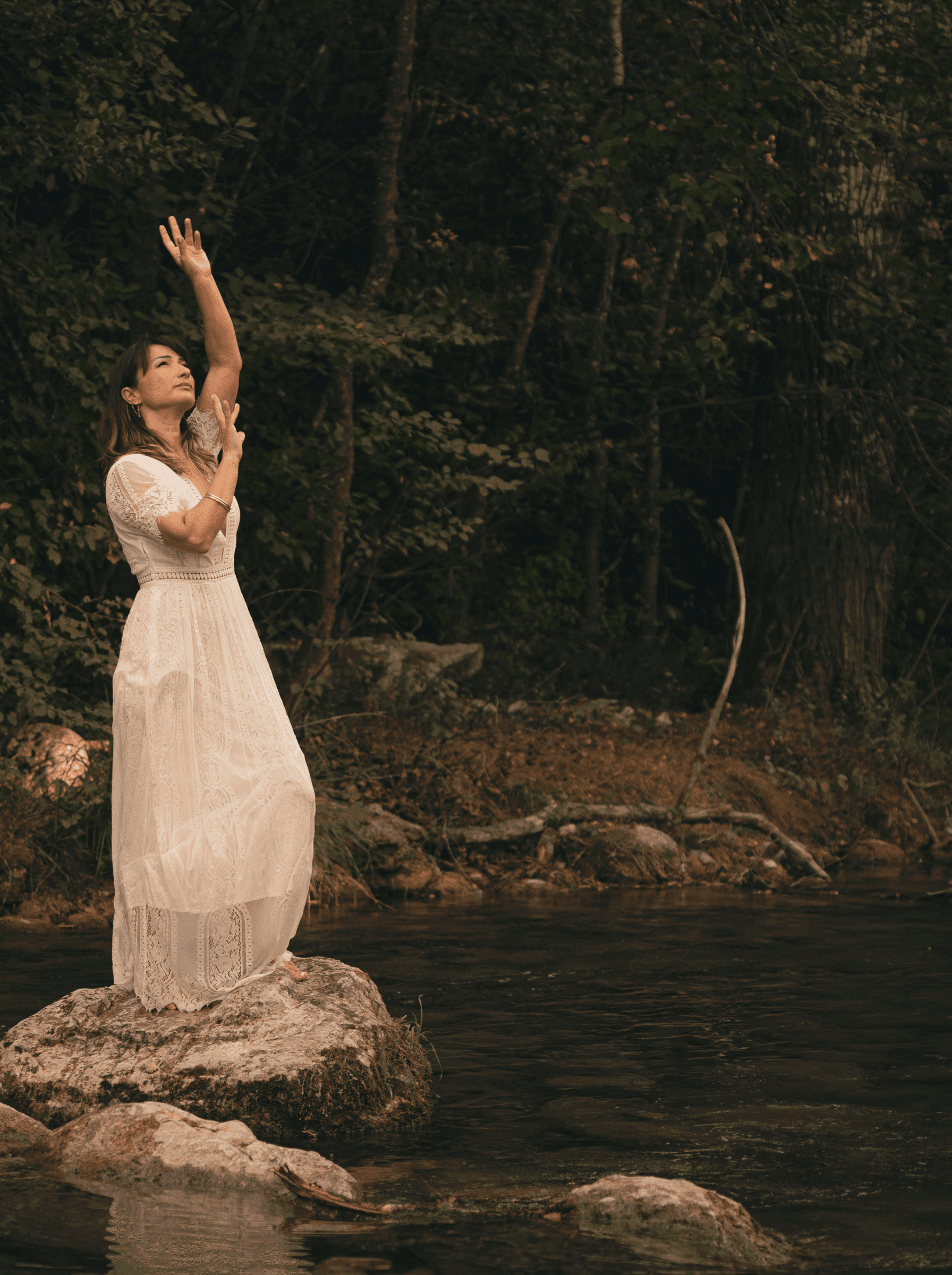 Marjorie in the middle of a river - talking to the sky