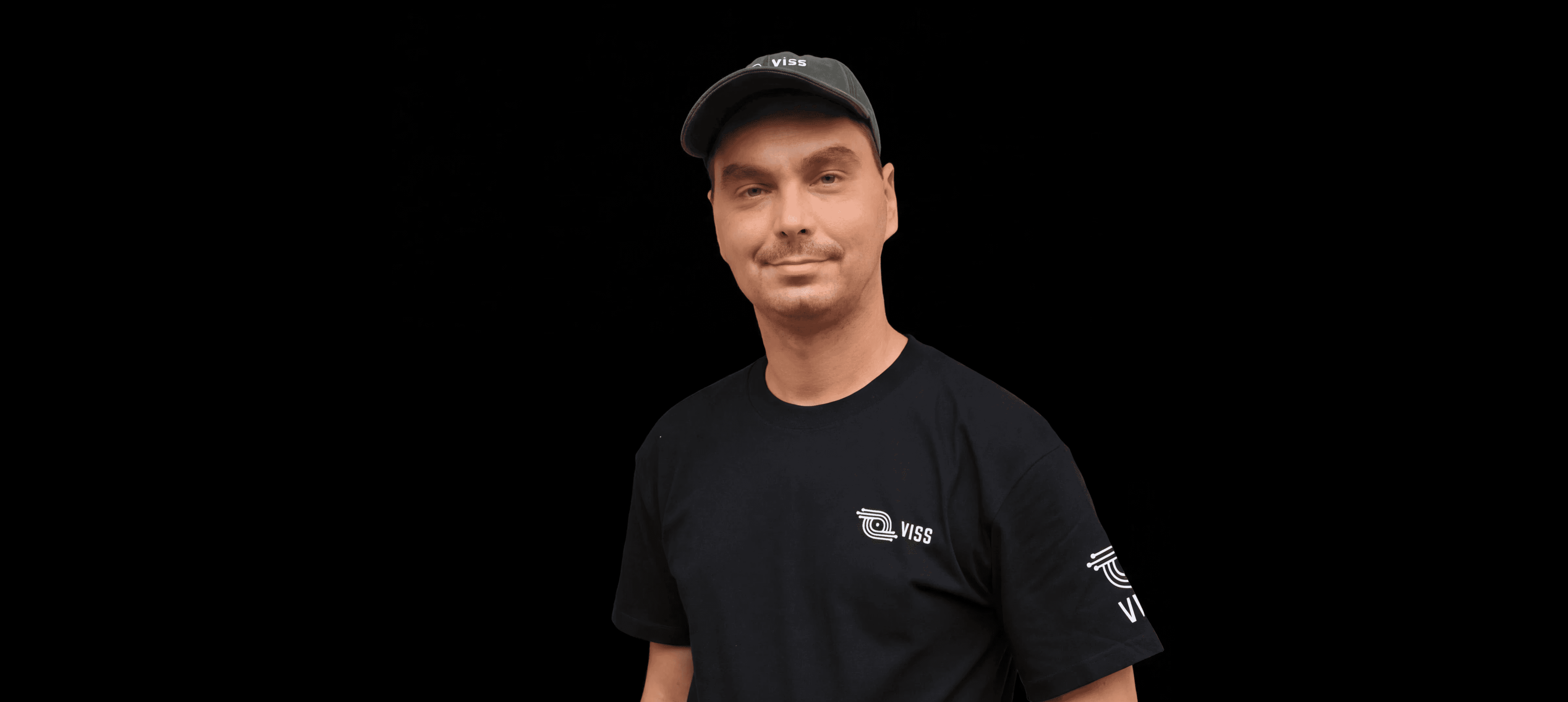 man wearing green crew-neck top and eyeglasses with black frames looking at side