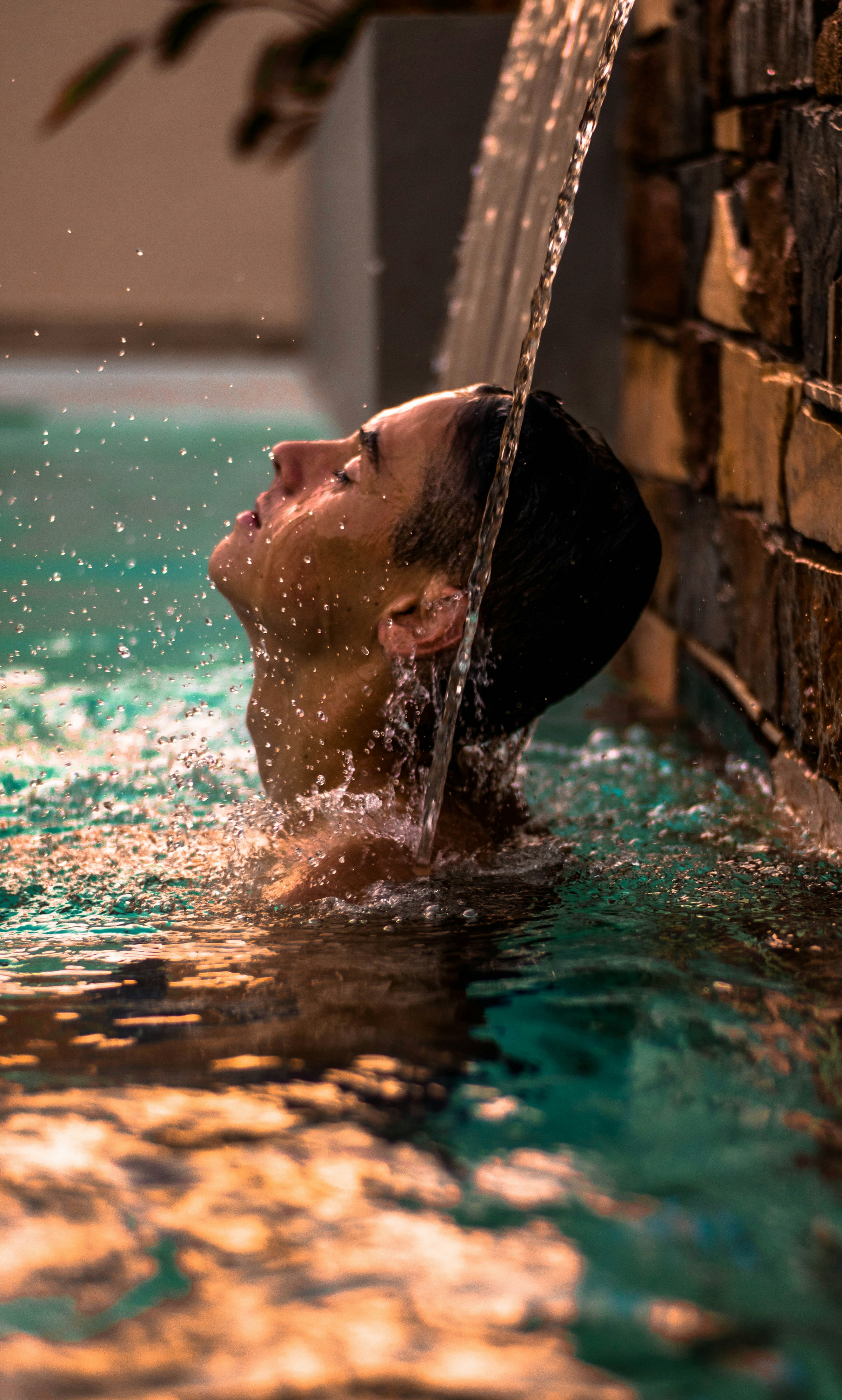 A woman rising out of cool water