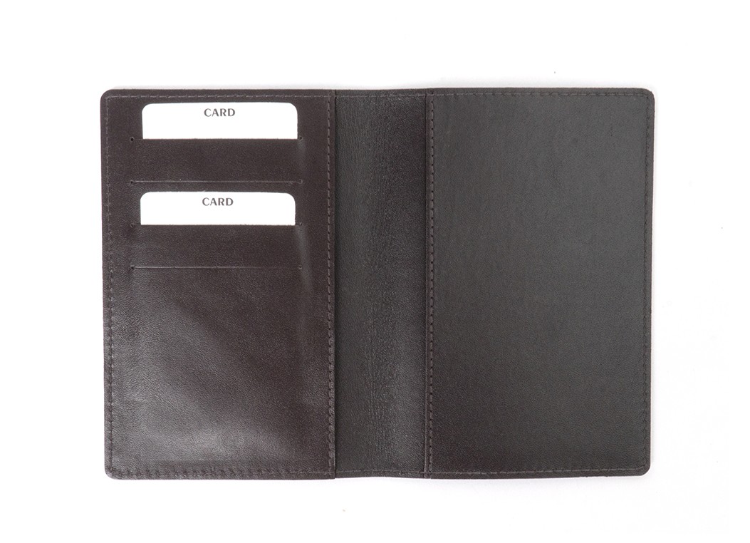 A flat lay view of the open wallet showing the dark brown interior with two card slots on the left and a passport sleeve on the right.