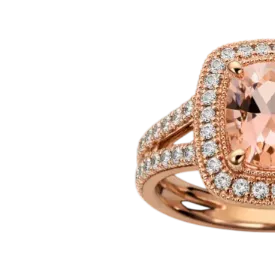A rose gold engagement ring featuring a large, rectangular pink gemstone surrounded by a halo of small, sparkling diamonds on a split shank band.