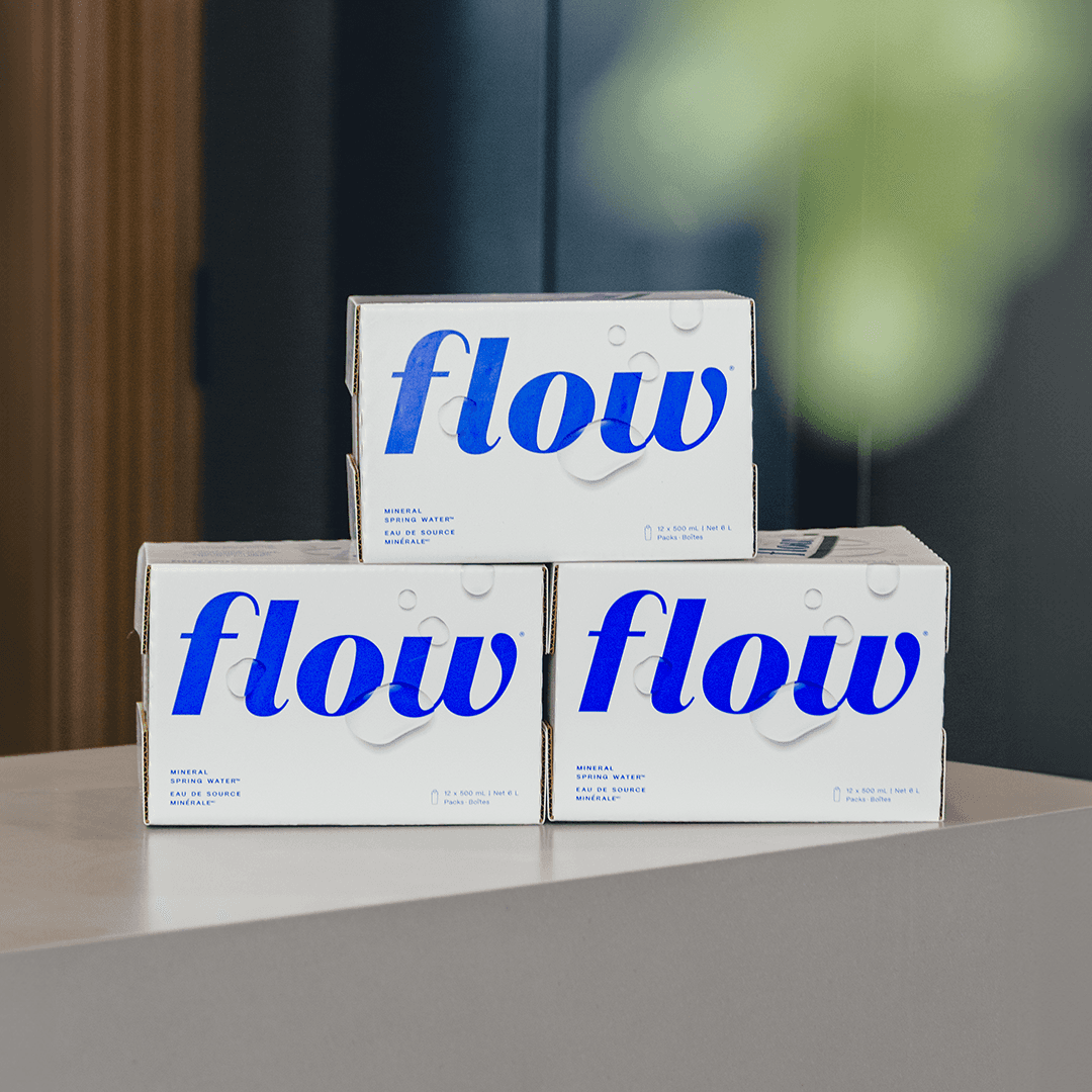 Minimalist brushed-steel chair in a white corner studio—industrial, brutalist modern furniture.