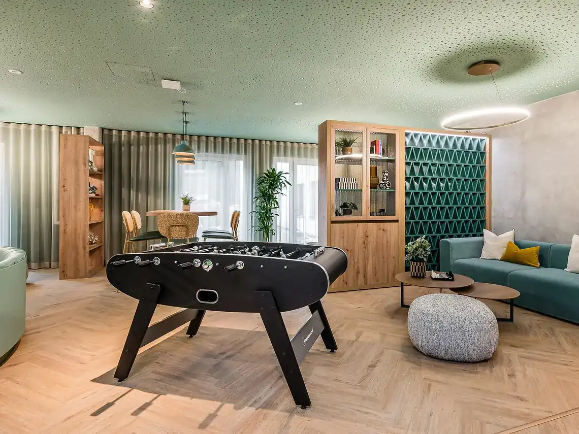 Student housing in Berlin with modern social lounge and games area