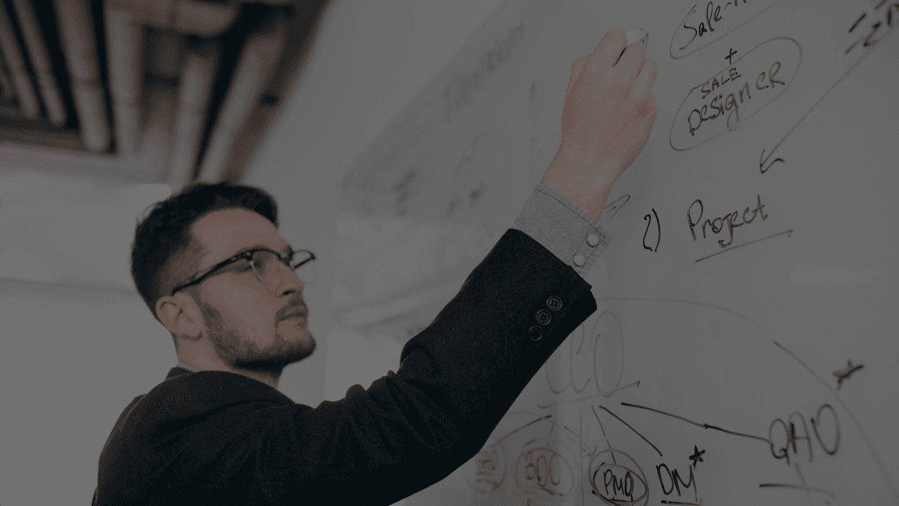 woman sitting around table holding tablet