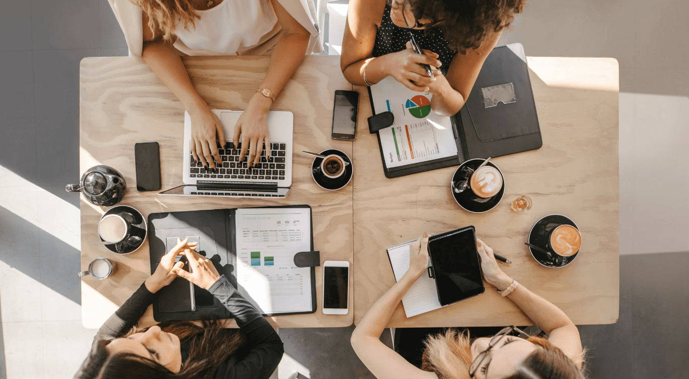 people sitting on chair in front of laptop computers
